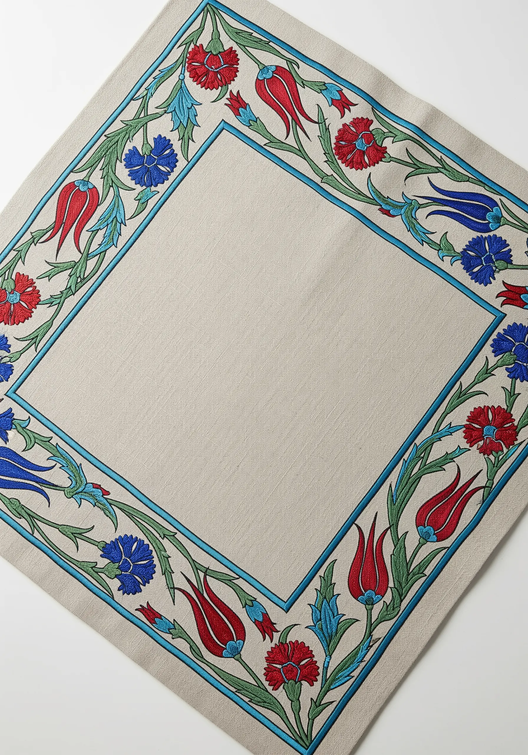 Turkish-inspired embroidered border with red tulips and blue carnations on a linen napkin.