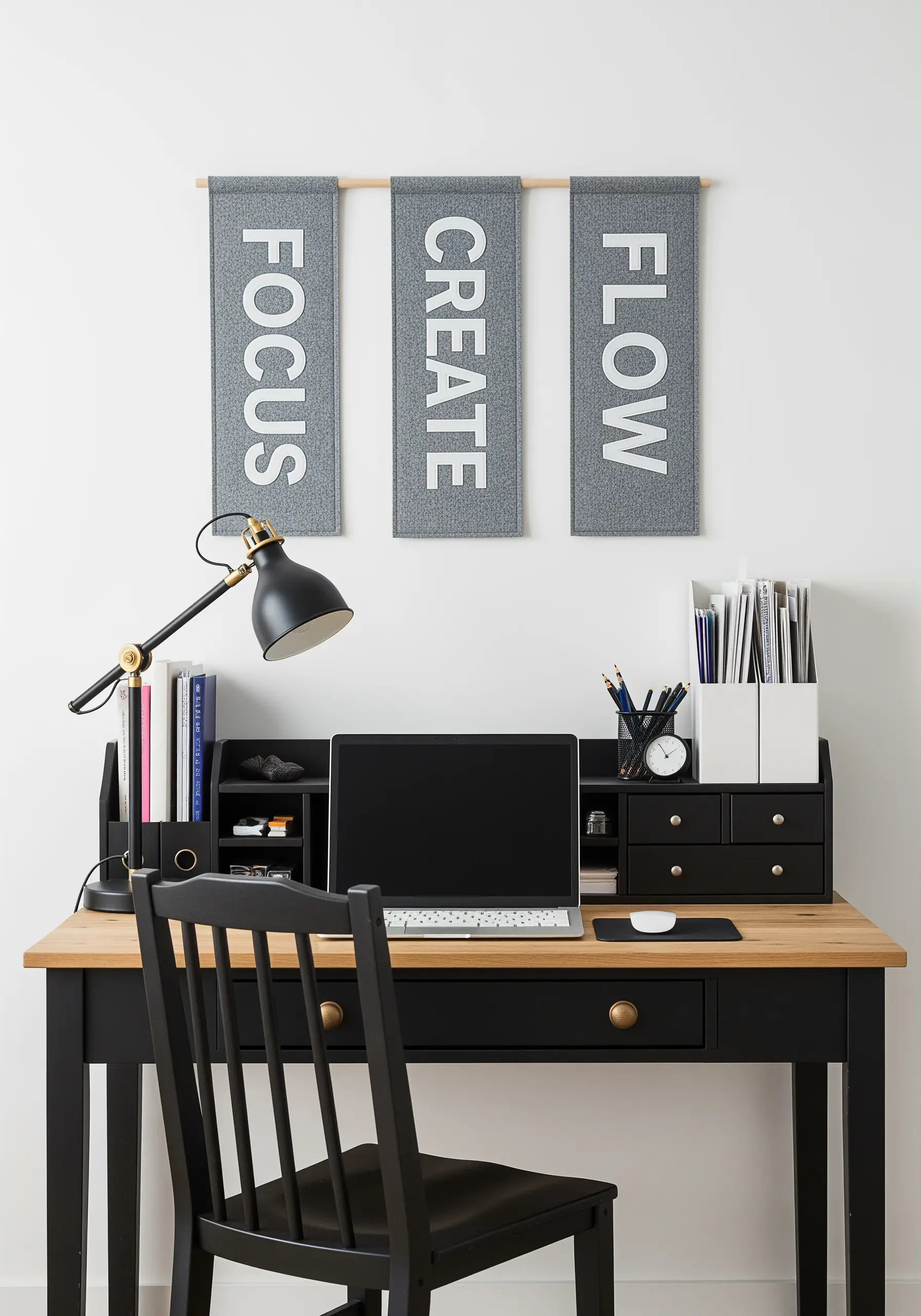 Three grey fabric banners with white felt appliqué letters spelling FOCUS, CREATE, FLOW.