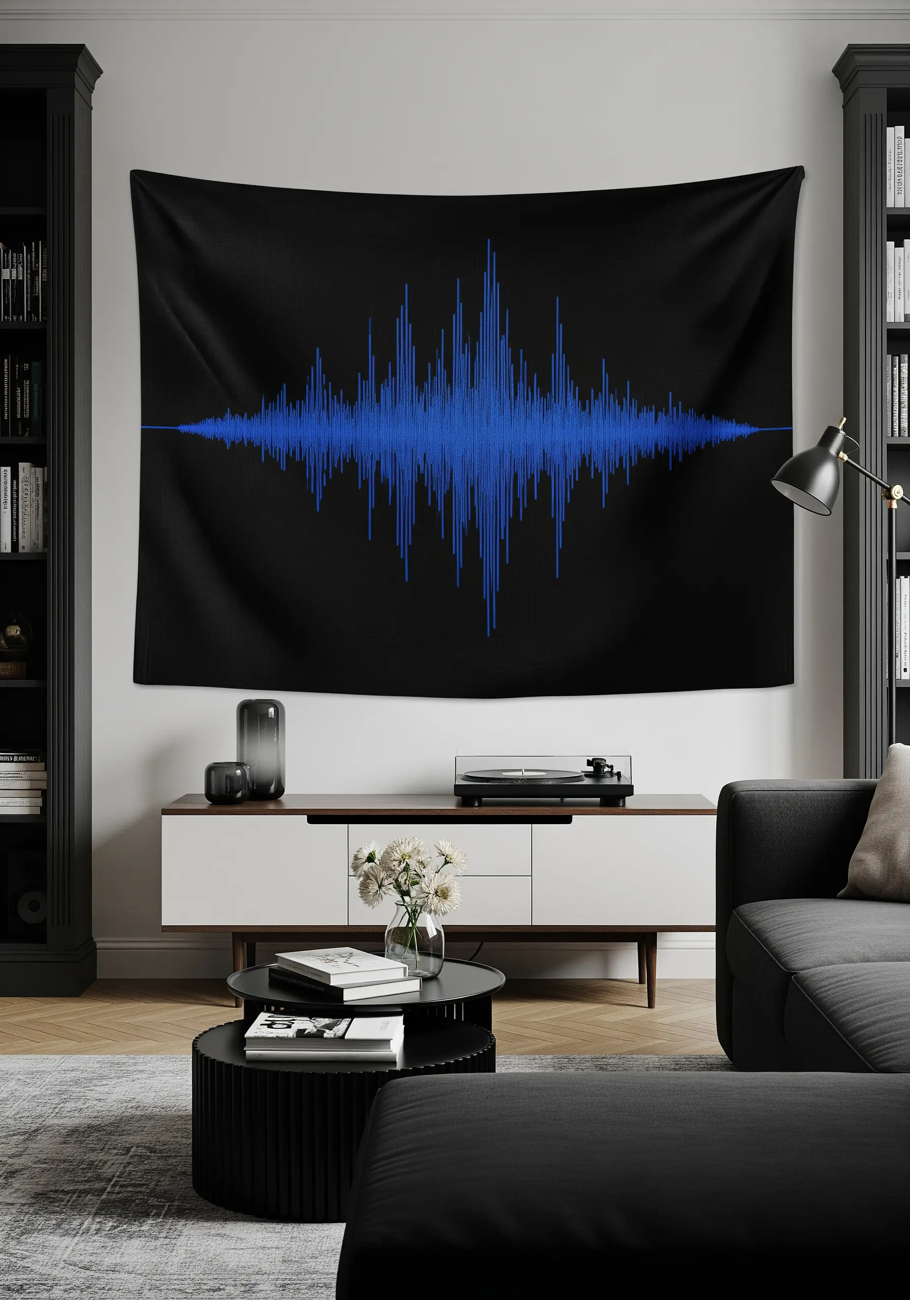 A tapestry on a black background featuring a bright blue embroidered audio waveform.