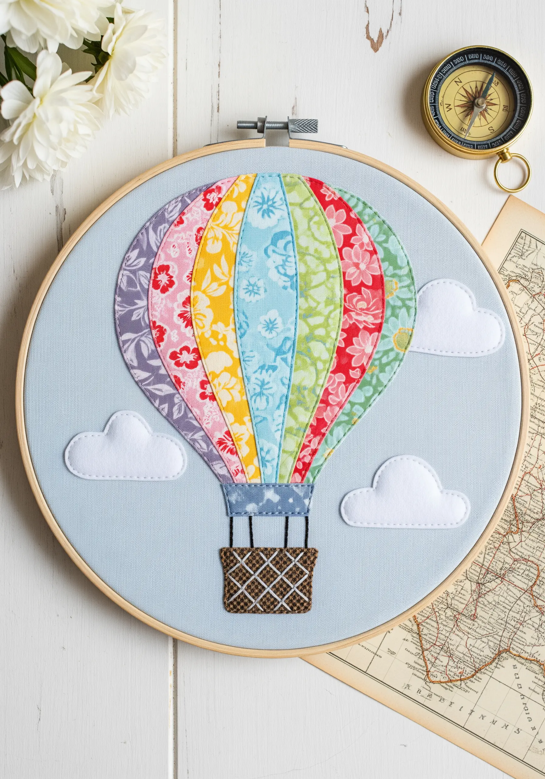 Hot air balloon made from colorful patterned appliqué with a brown woven basket.