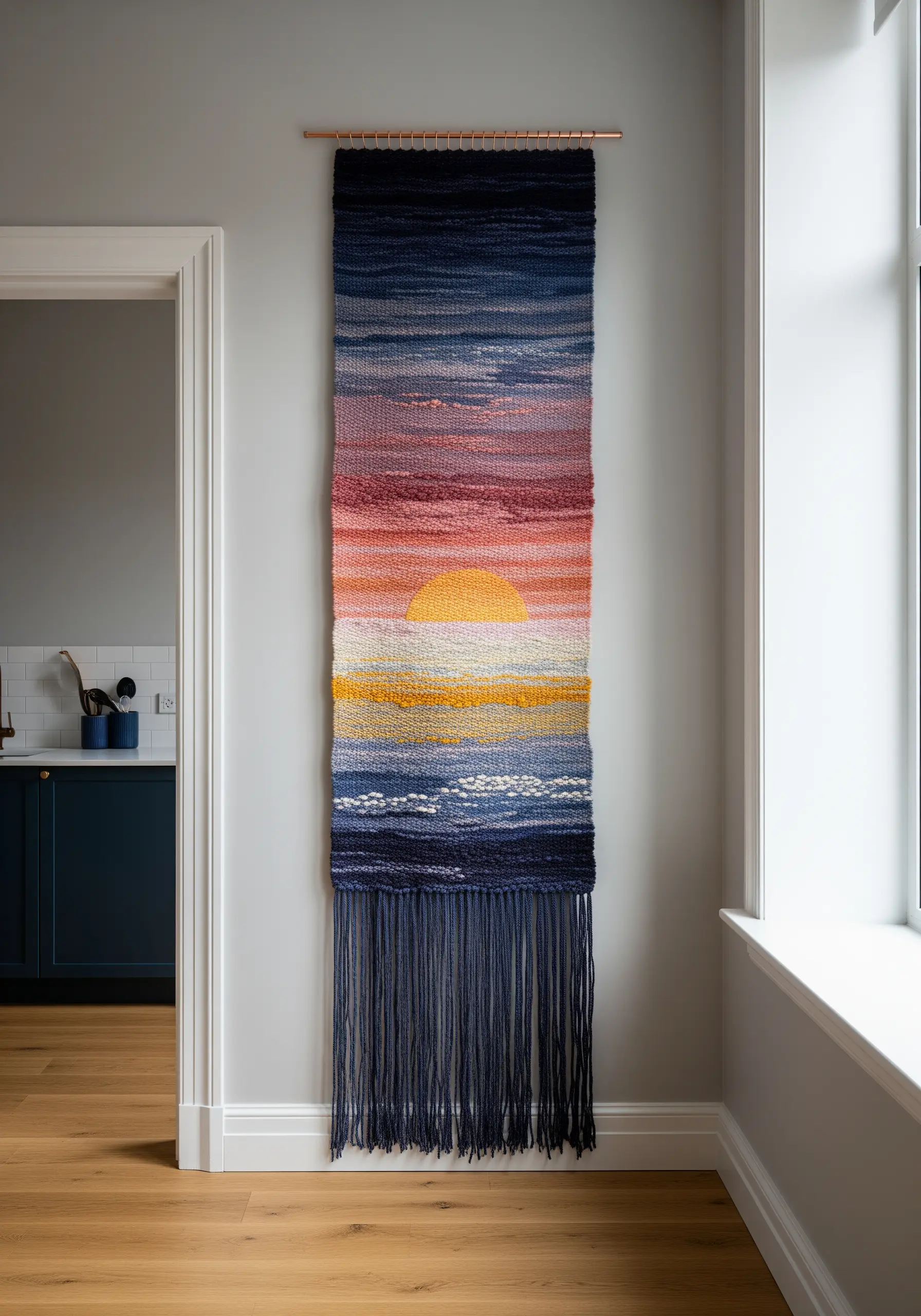 Woven wall tapestry depicting a sunset over the ocean with textured yarn.