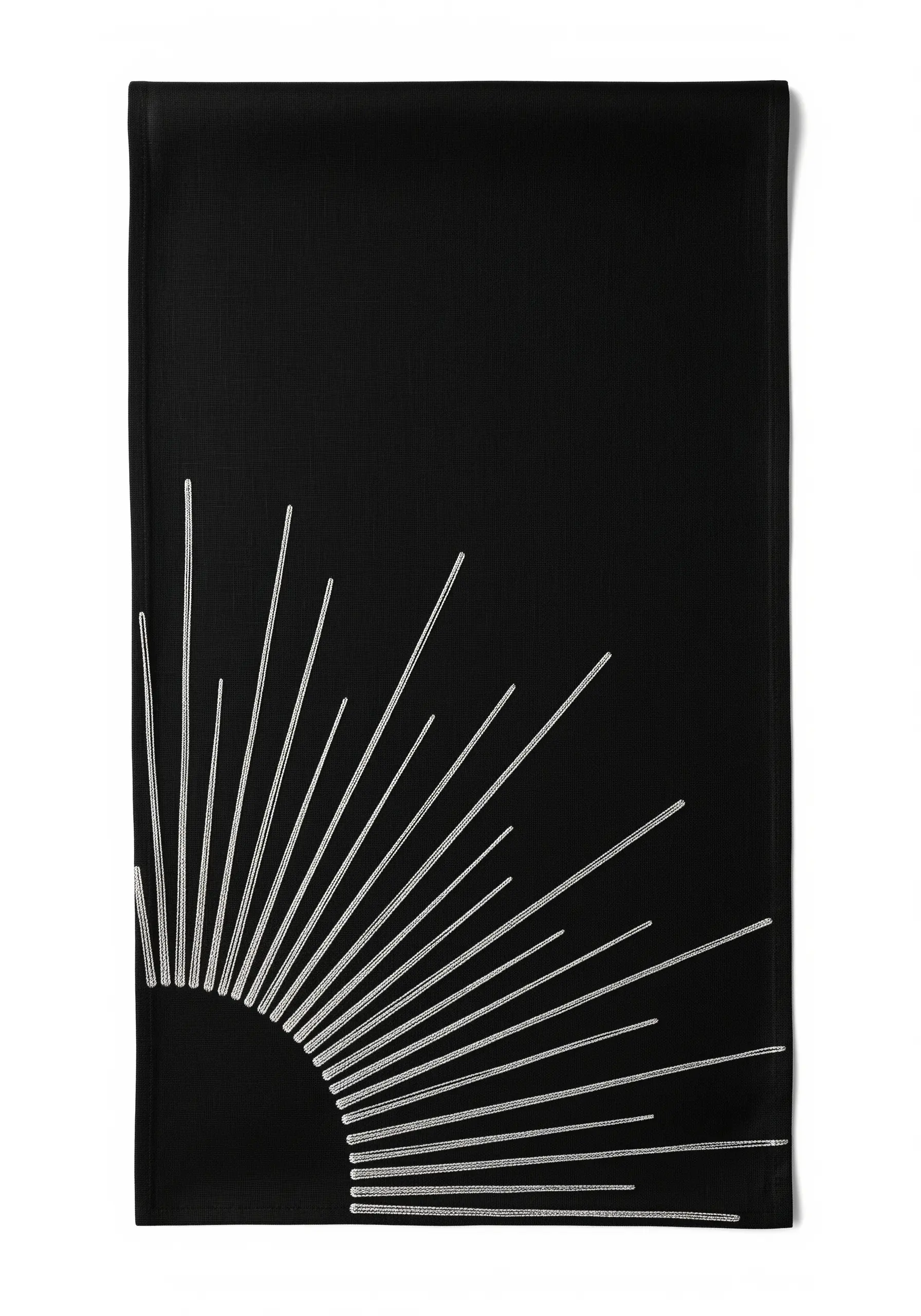 A bold sunburst motif with radiating lines embroidered in silver on black fabric.
