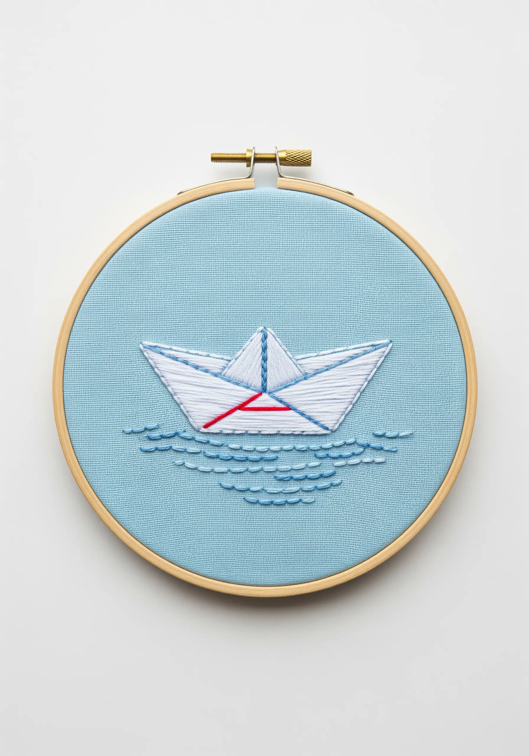 Minimalist paper boat embroidery with white outlines and a single red accent line.