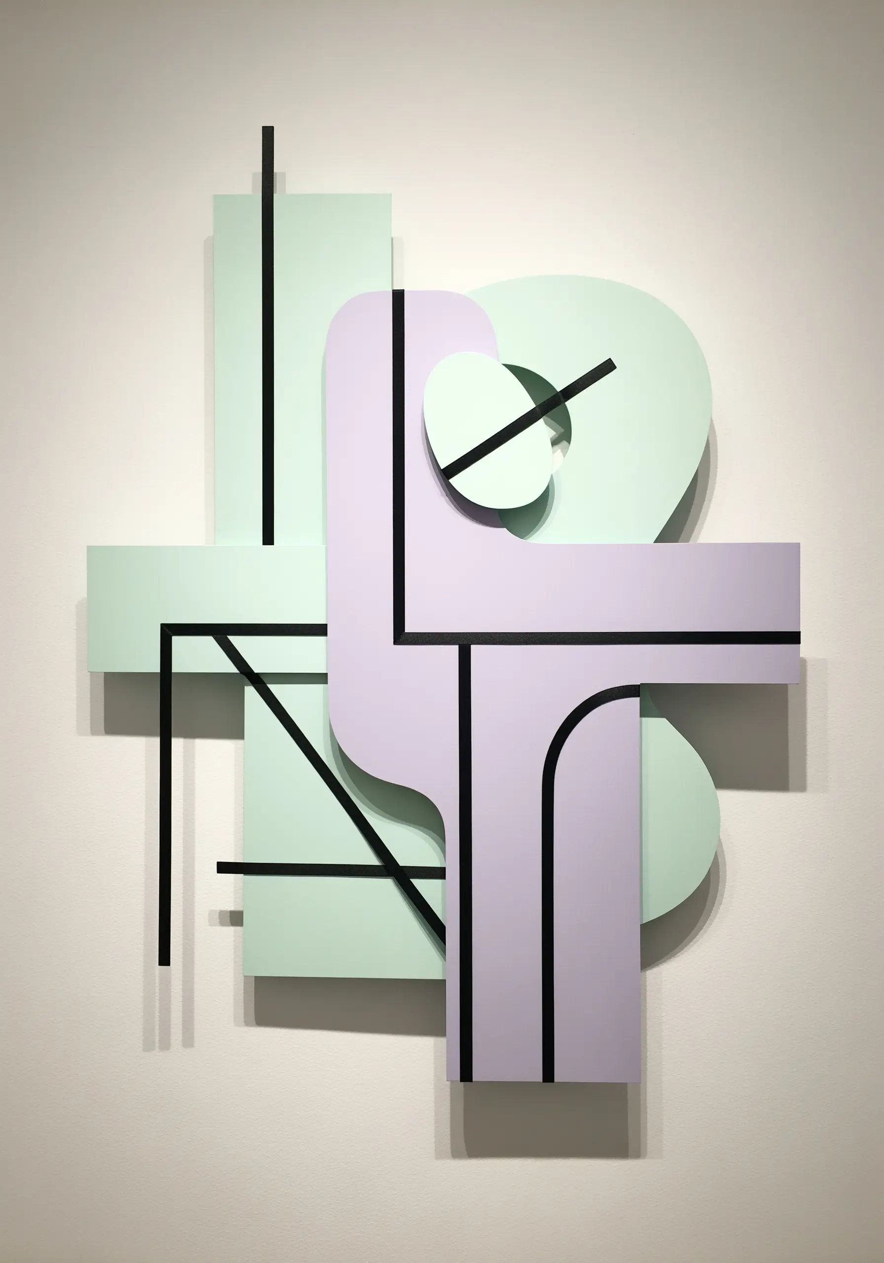 Pastel paper shapes connected by thick black thread lines