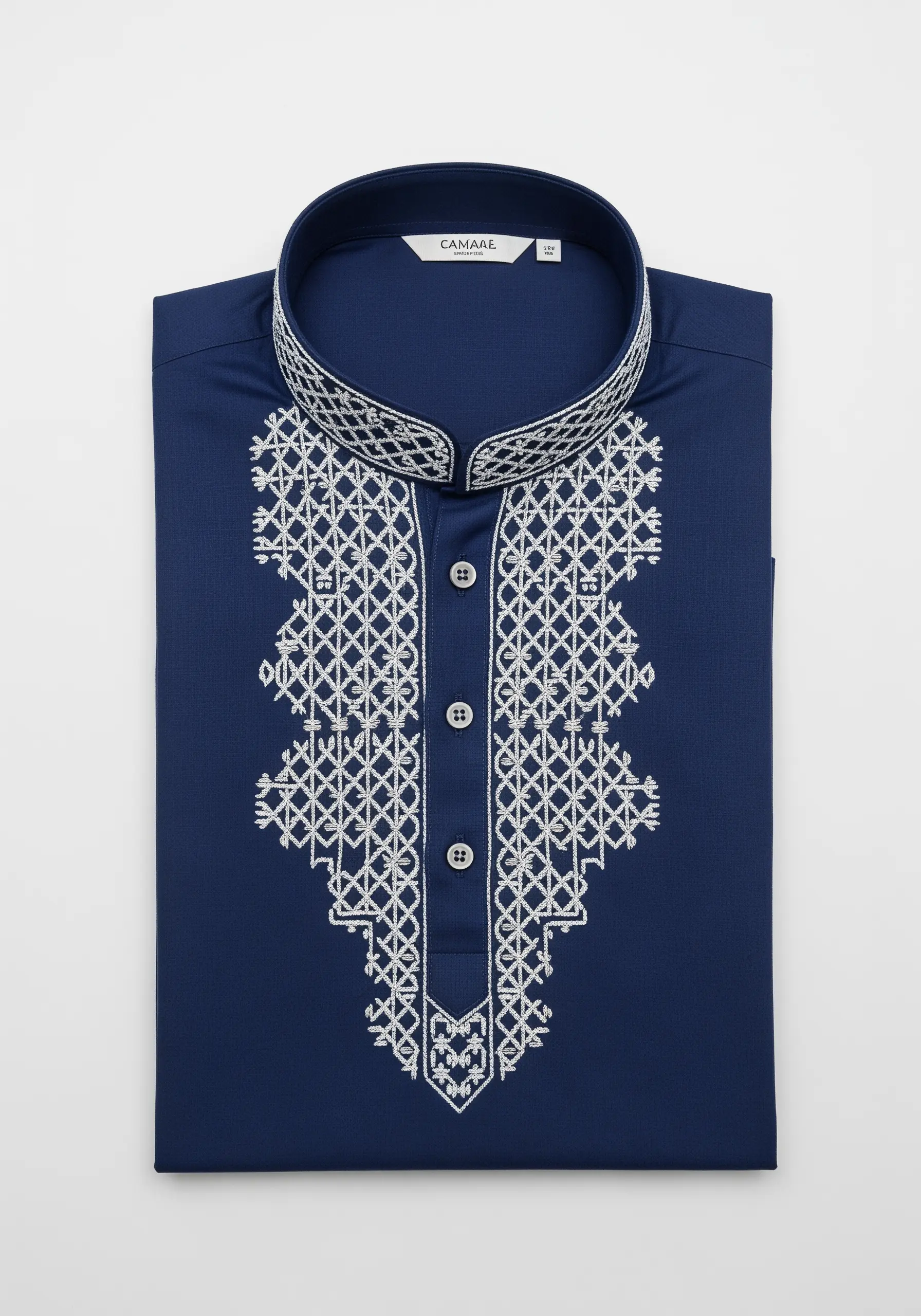 White geometric lattice embroidery on the placket and collar of a folded navy blue men's shirt.