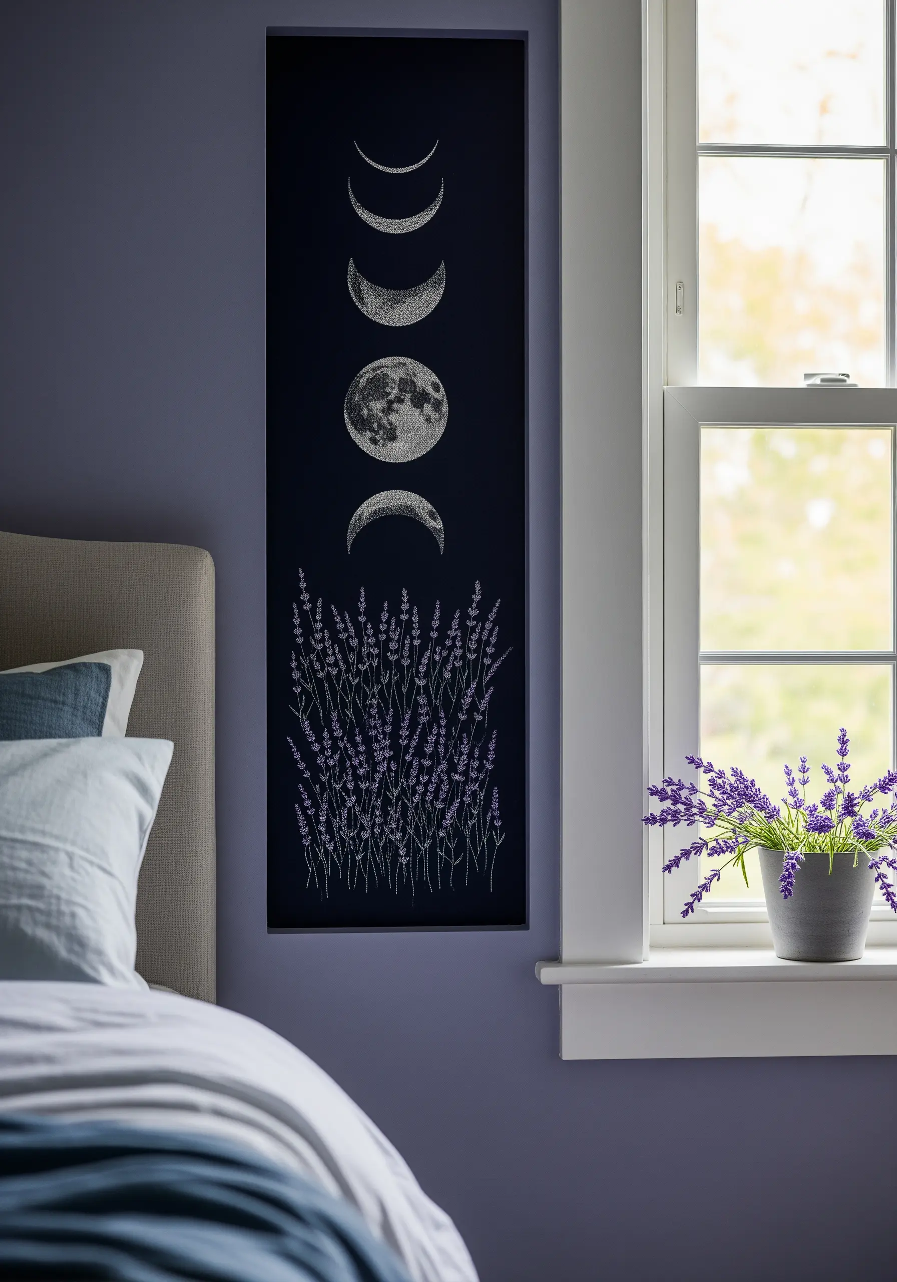 A vertical embroidery panel showing the phases of the moon above a field of lavender.
