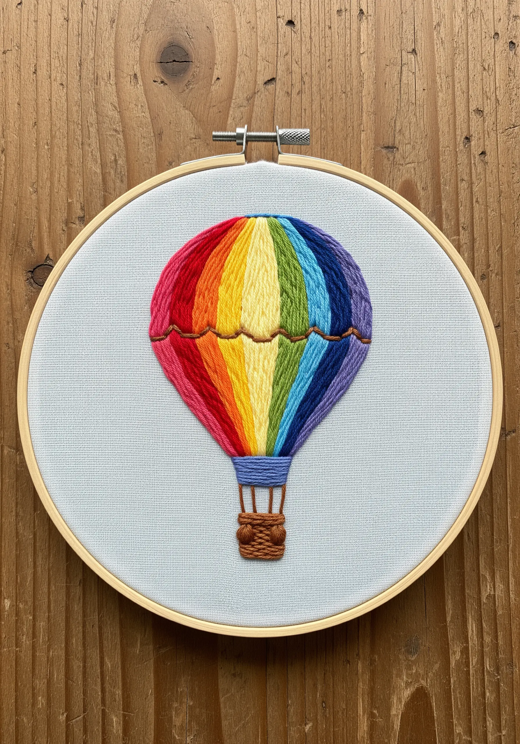 A hot air balloon with vibrant, perfectly executed vertical satin stitch stripes.