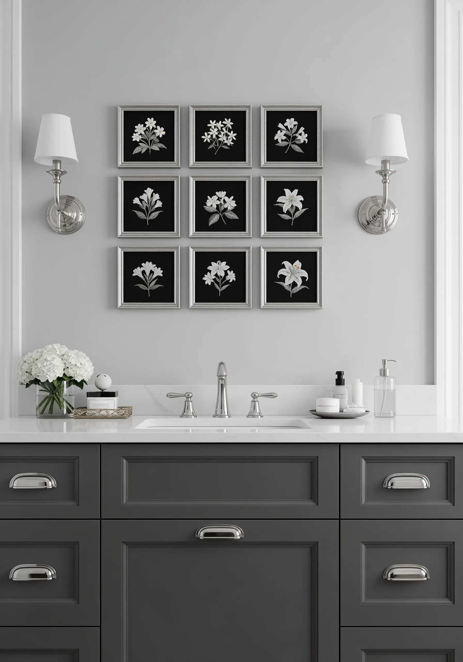 A perfect grid of nine framed embroideries, each showing a white flower on a black background.