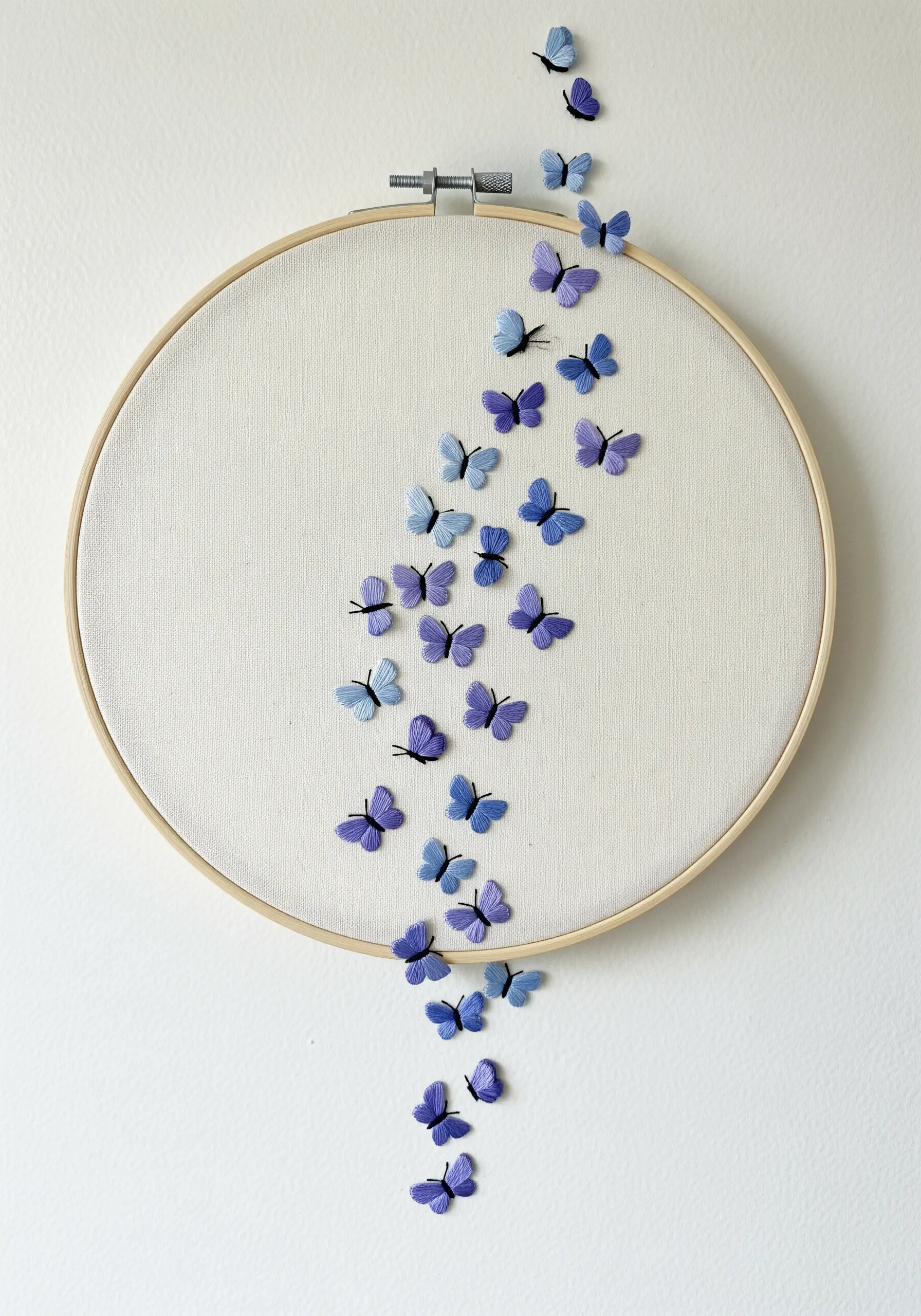 A cascade of 3D embroidered butterflies in shades of purple, appearing to fly out of the hoop.