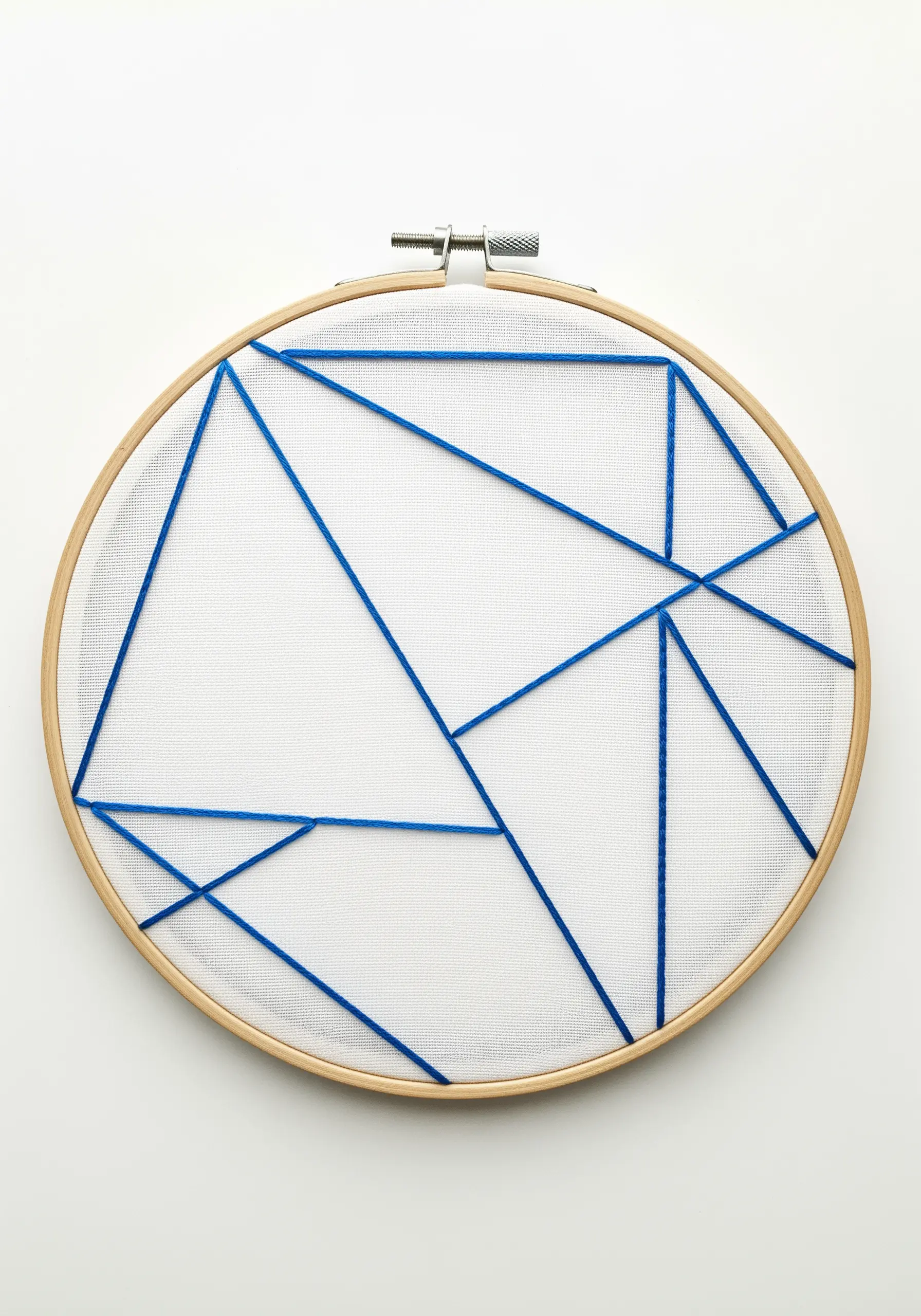 Electric blue threads create intersecting geometric lines across white mesh fabric.
