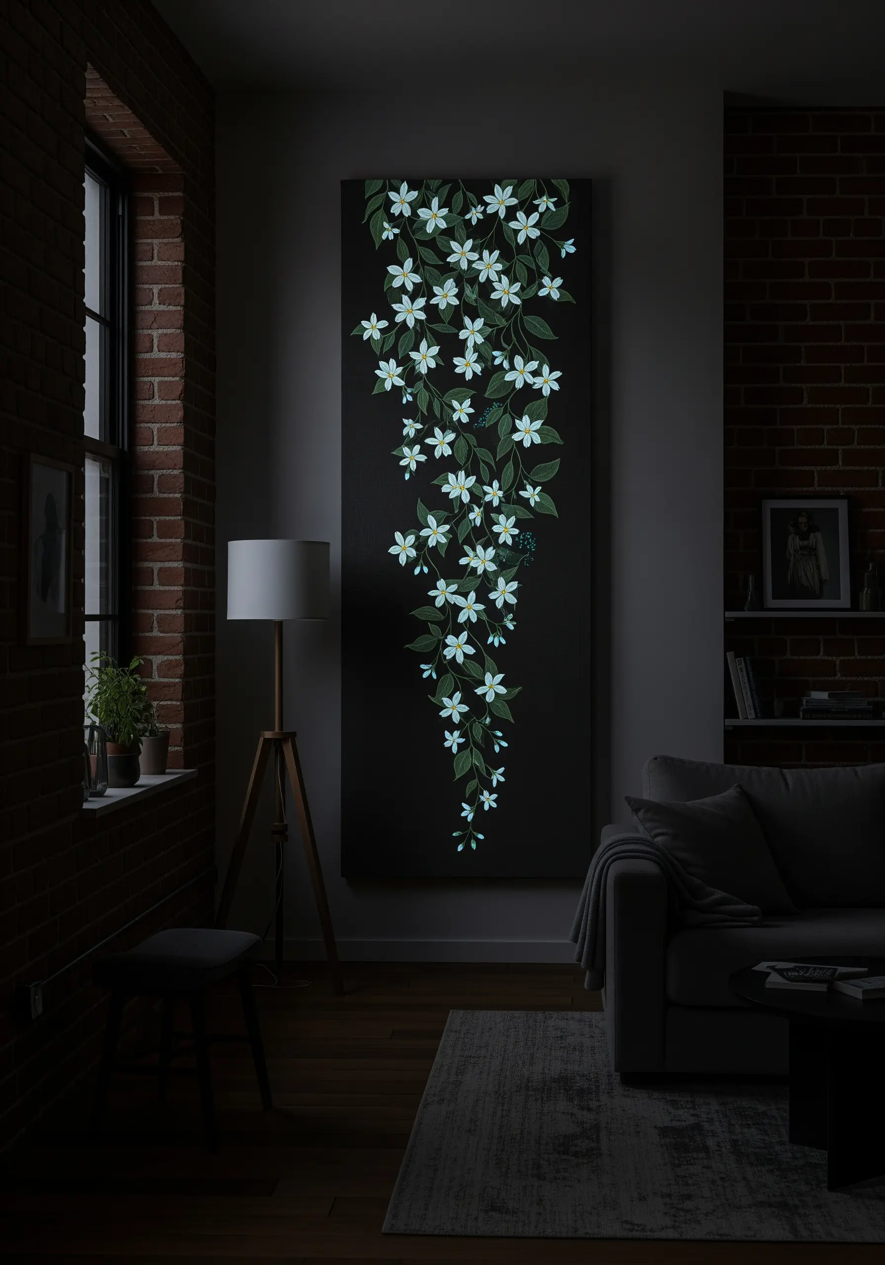 A tall black canvas with an embroidered vine of white flowers that are glowing in the dark.