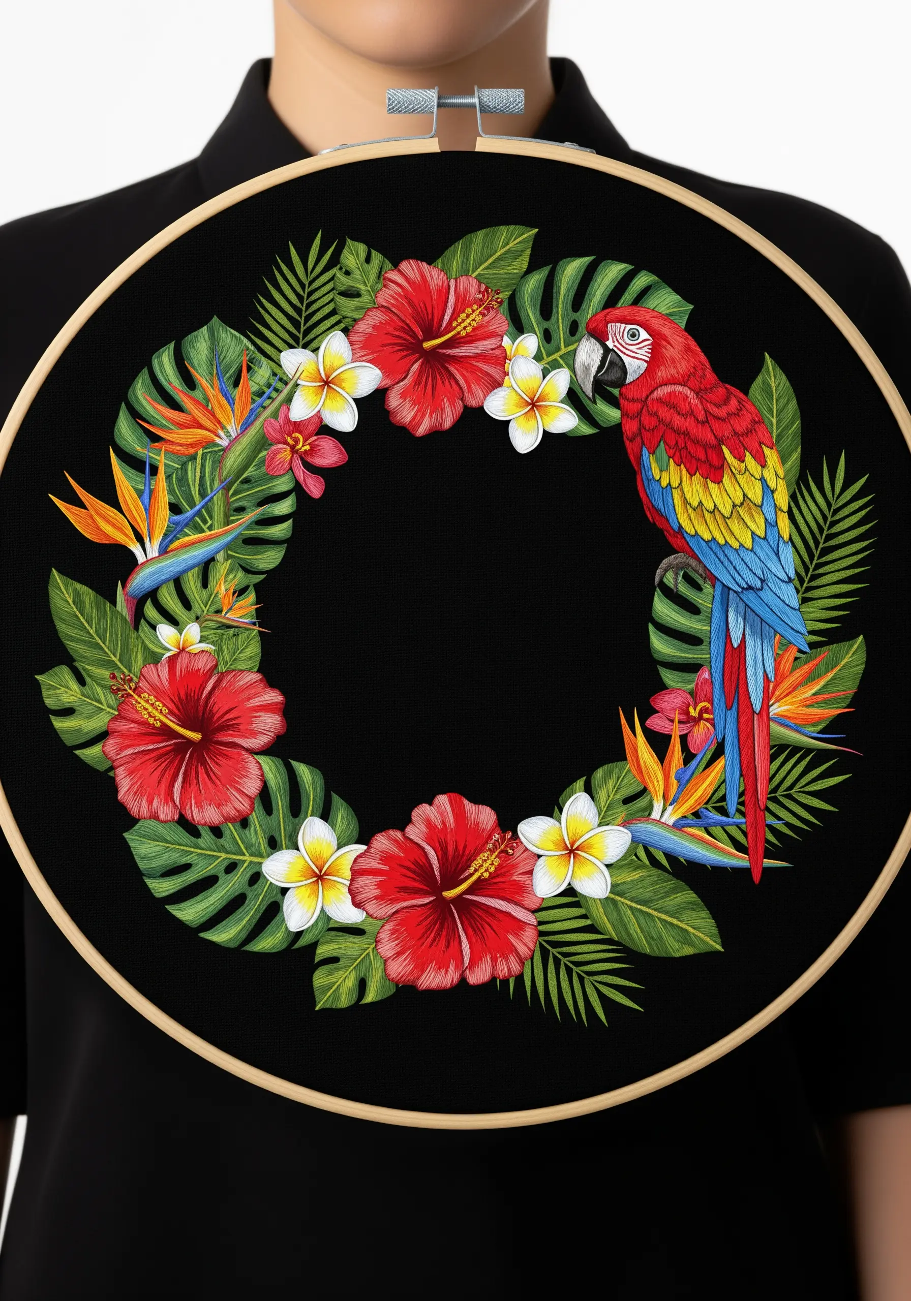 A tropical wreath with a scarlet macaw and hibiscus flowers embroidered on black fabric.