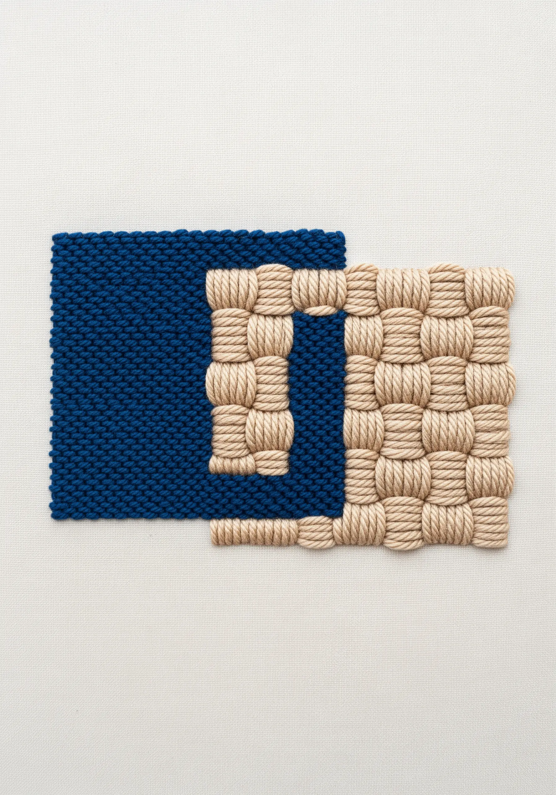 An abstract geometric shape with woven beige thread and a solid blue block.