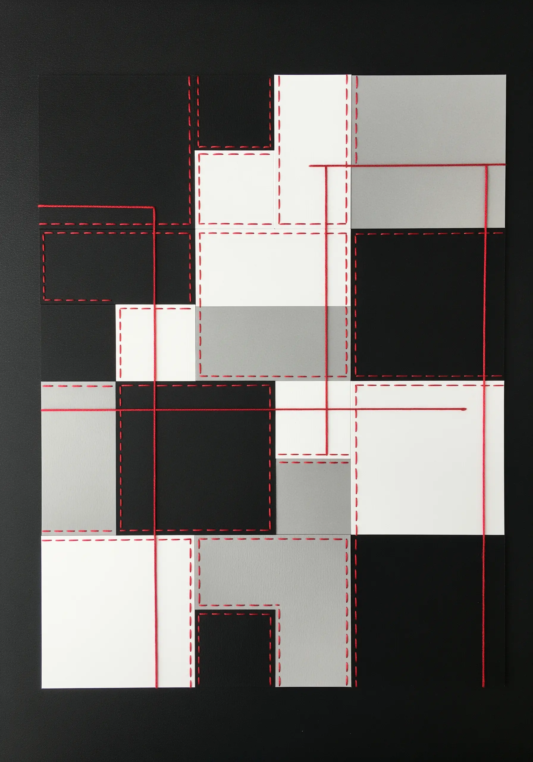 Geometric collage in black, white, and grey with red thread outlining shapes and crossing lines.