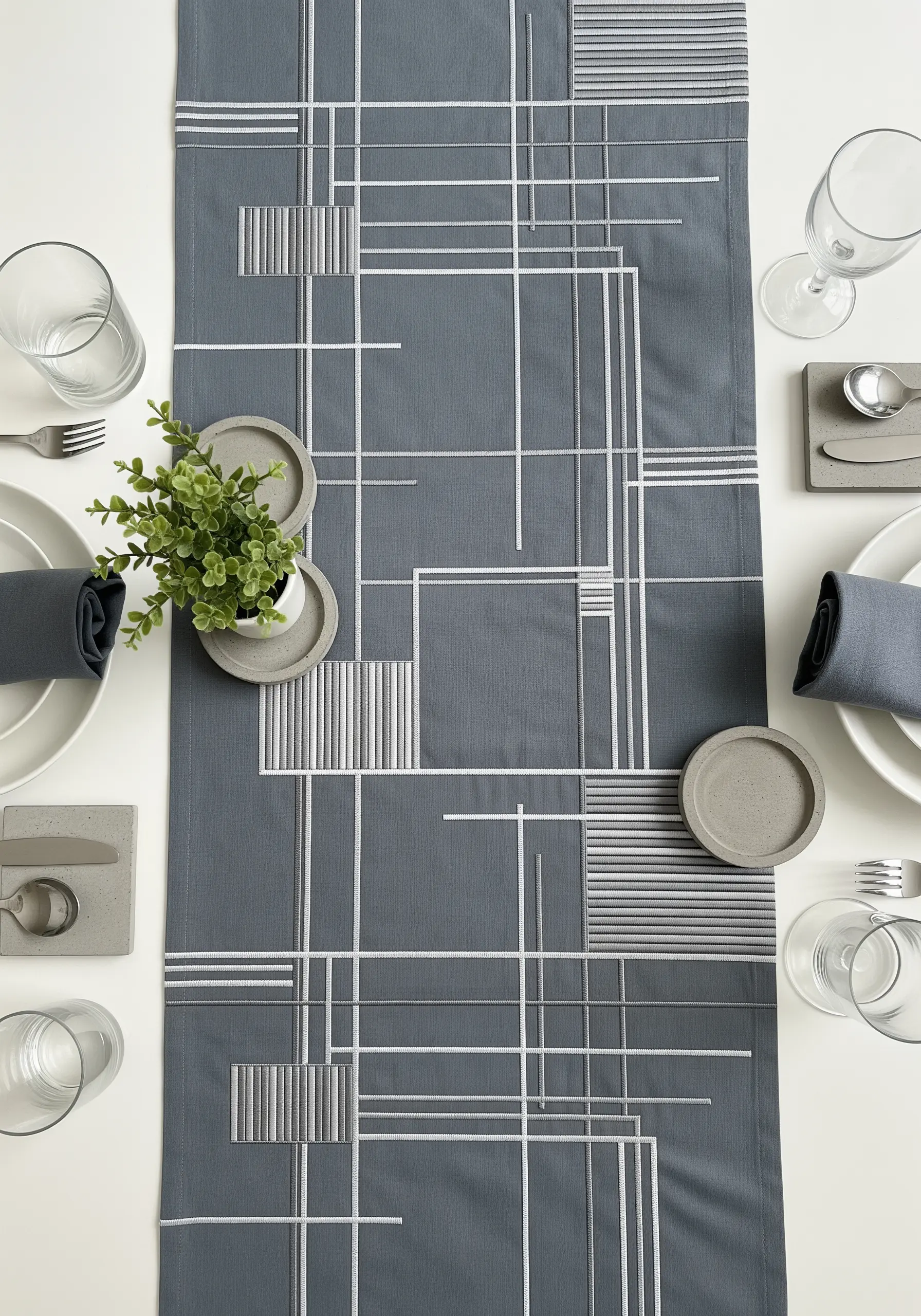 Modern table runner with white and grey embroidered lines and rectangles