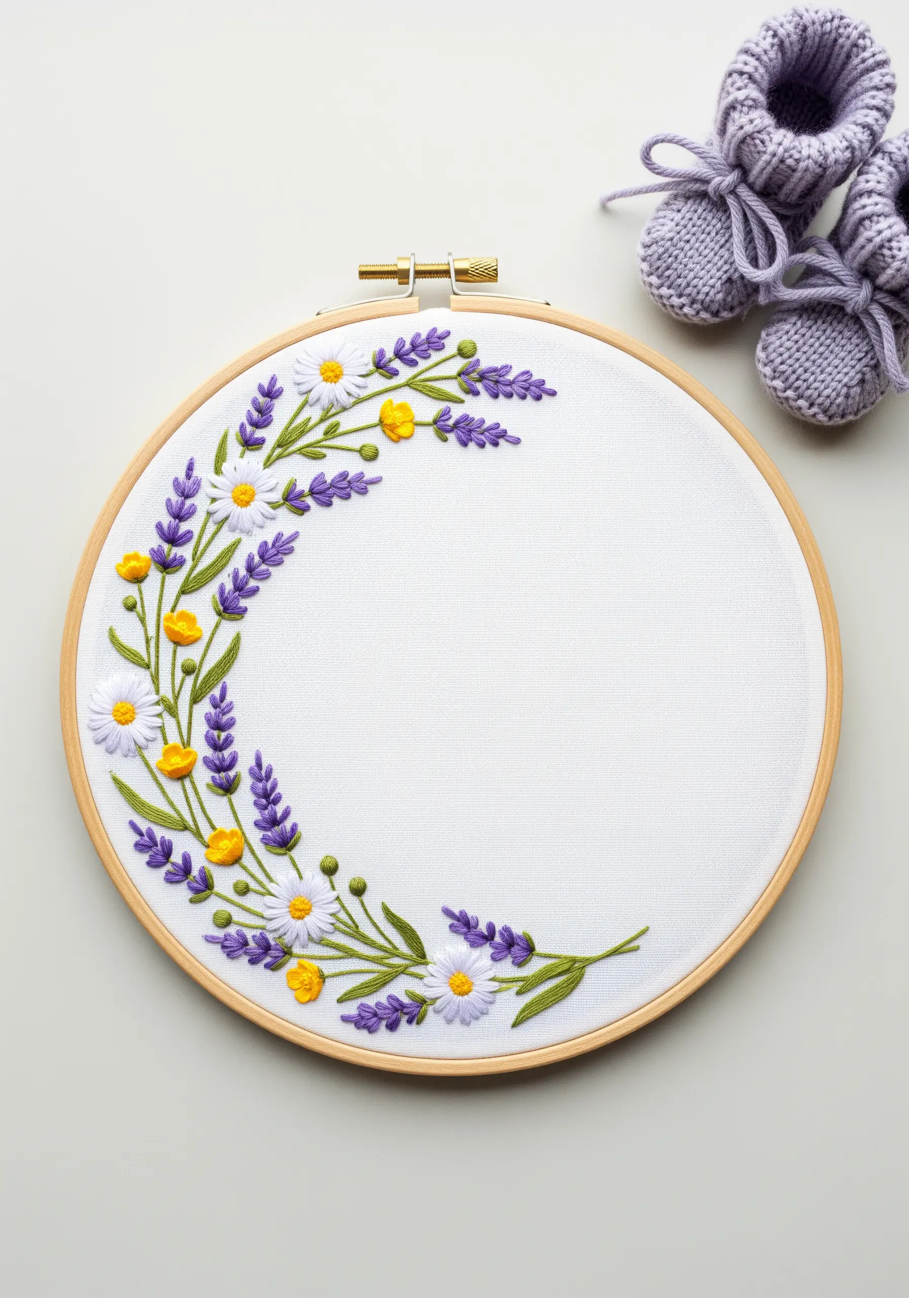 Crescent floral frame with embroidered lavender, daisies, and yellow buttercups on white fabric.