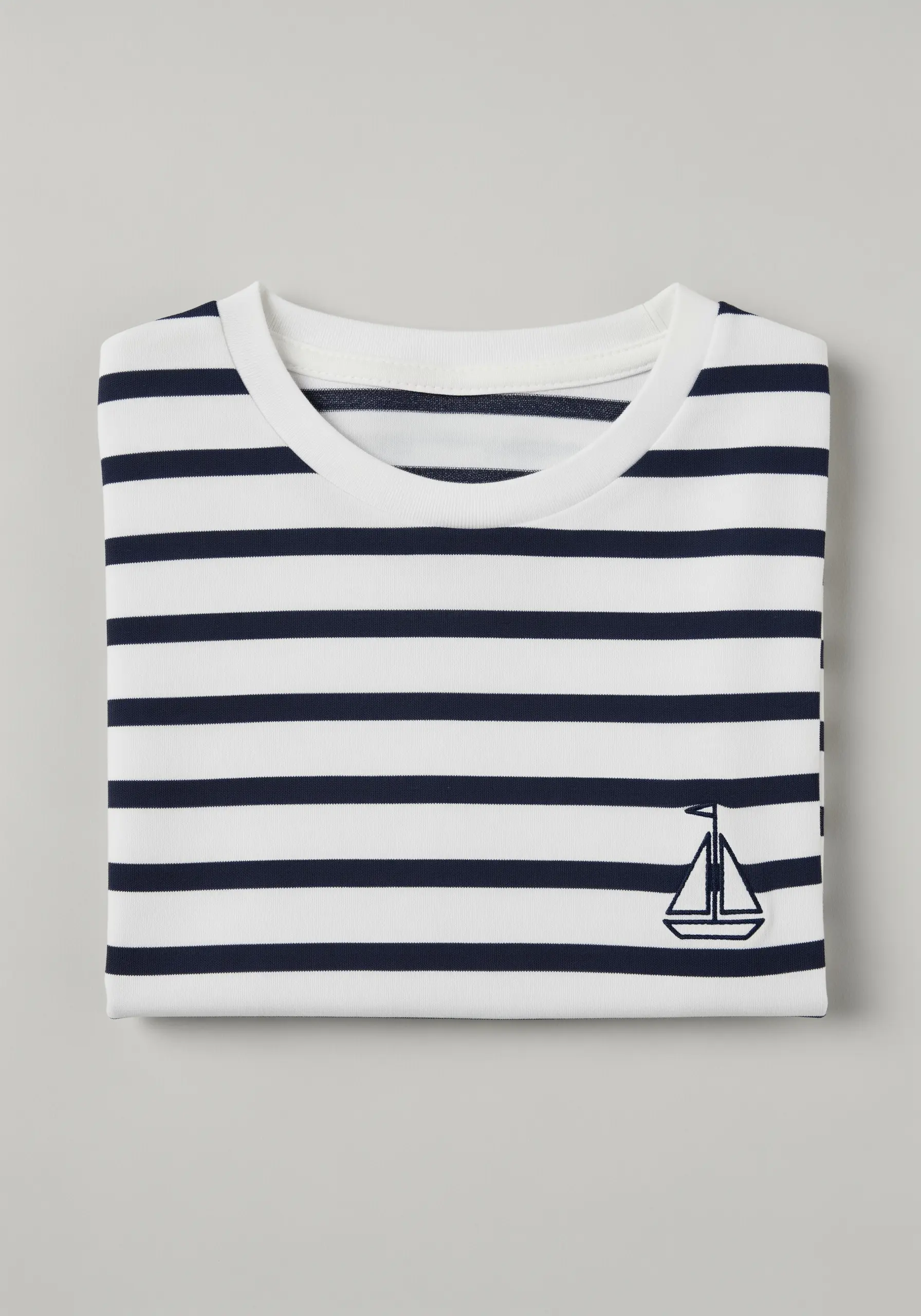 Navy blue sailboat icon embroidered on a white and navy striped t-shirt.