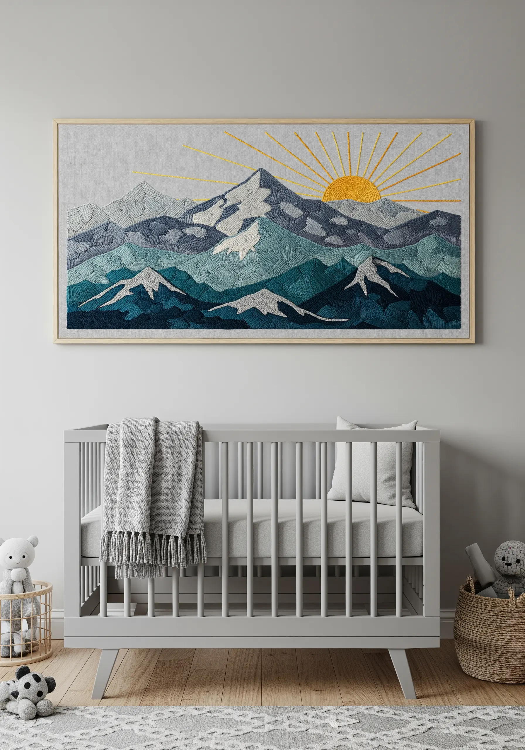 Embroidered mountain landscape with satin stitch color blocking and a rising sun.