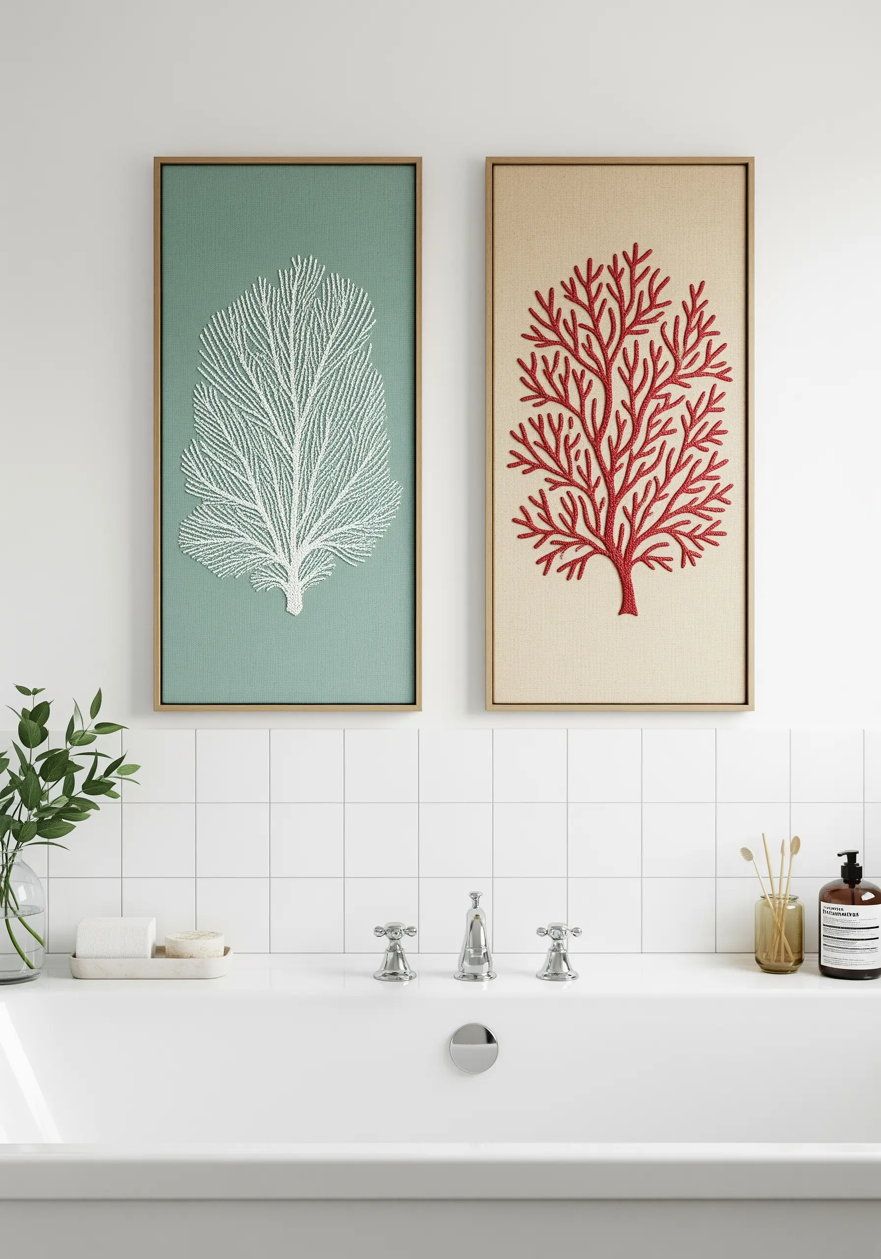 Two framed embroidery pieces in a bathroom, one of white coral and one of red coral.