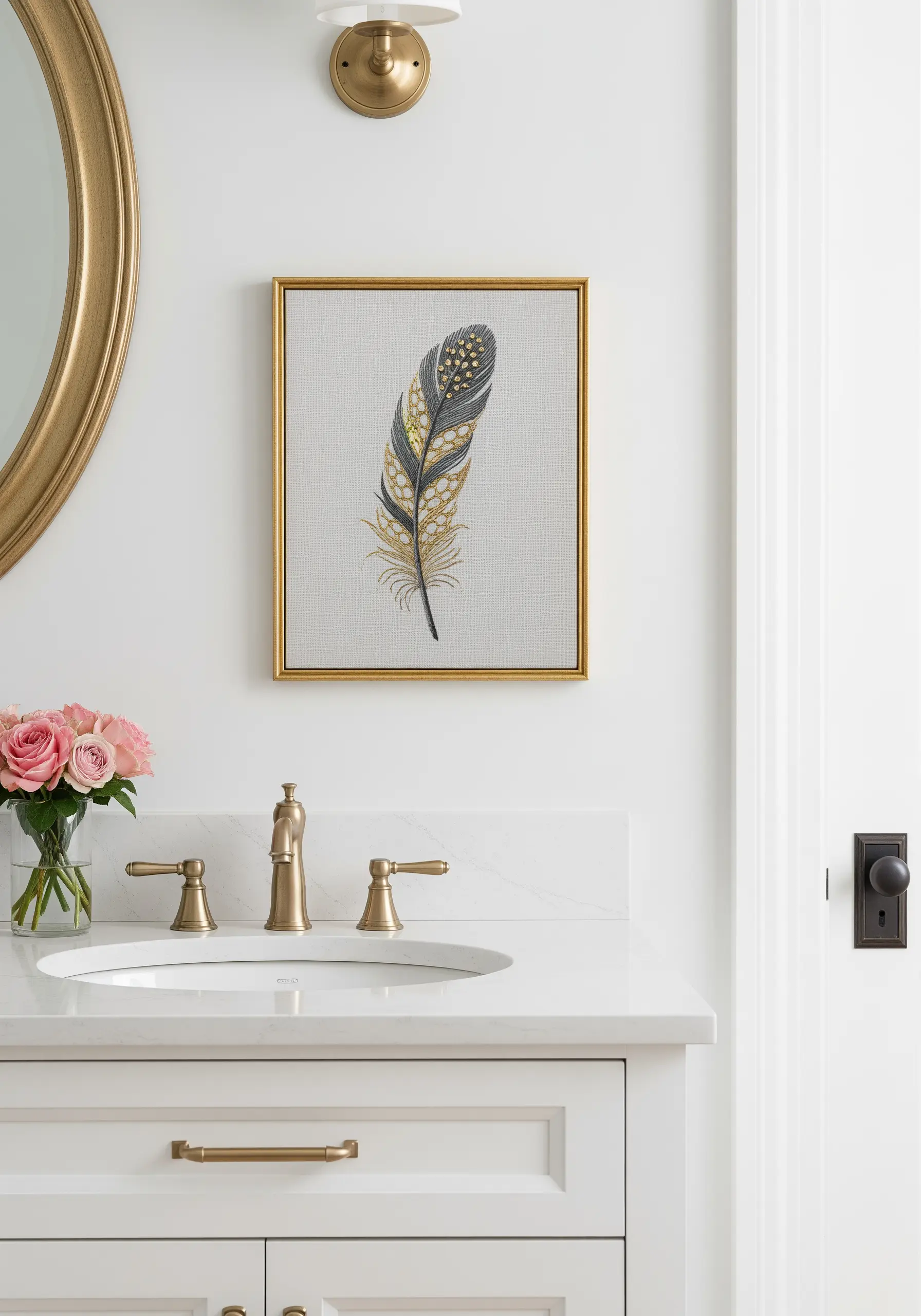 Framed embroidery of a detailed feather using multiple stitches in gold, black, and white.