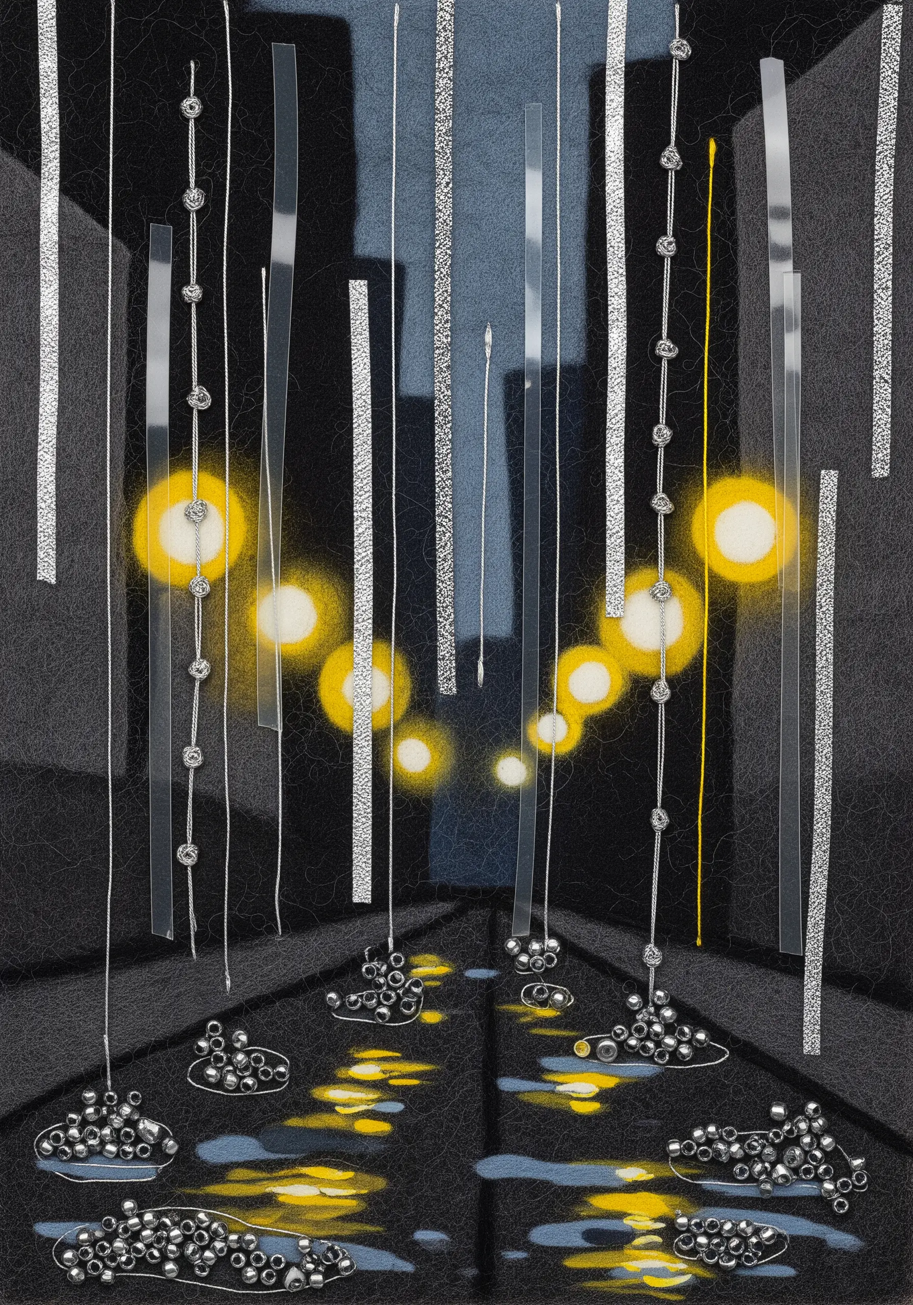 Abstract rainy city scene using felt, beads, and translucent strips to show light and reflections.