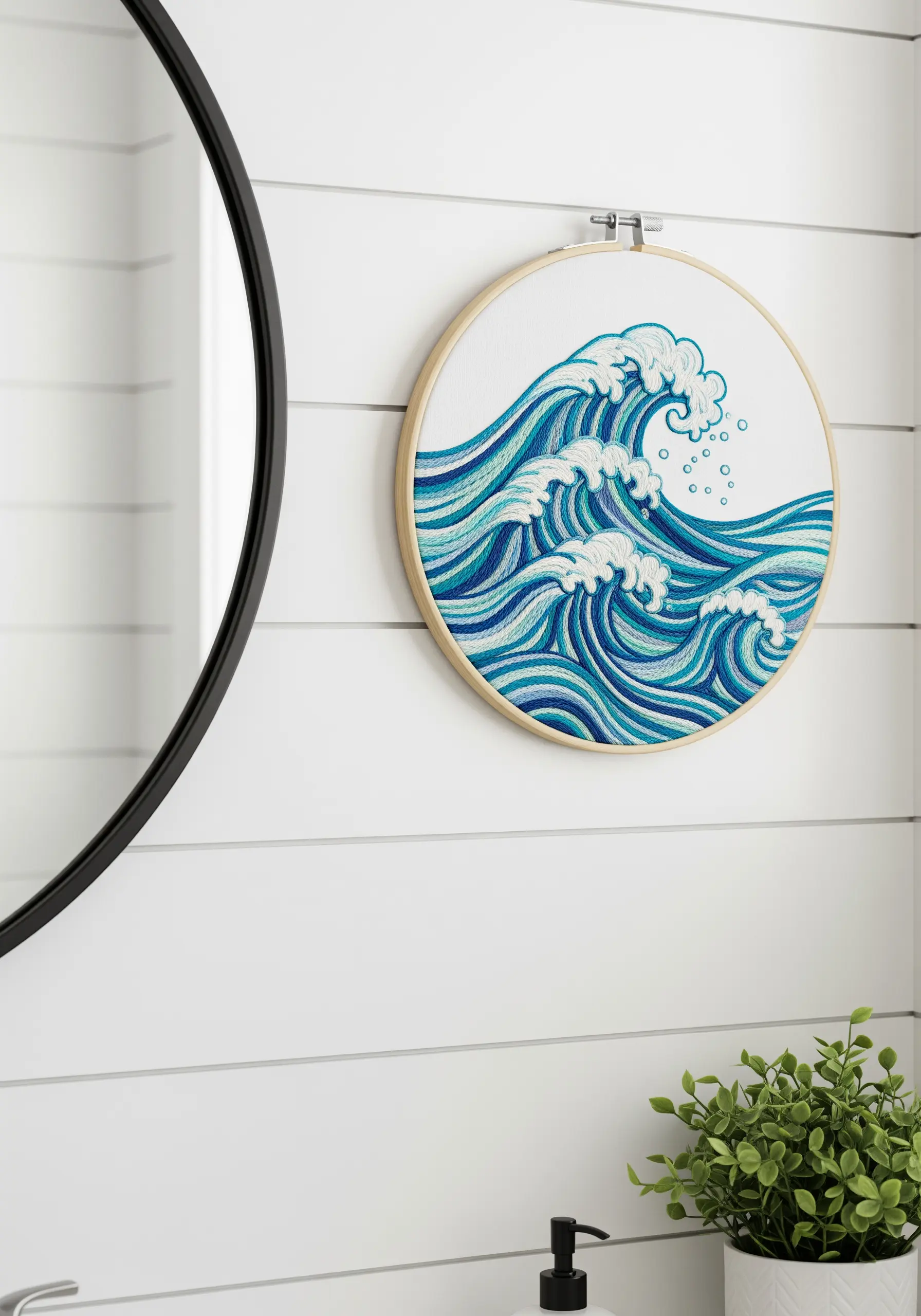 A dynamic embroidered ocean wave with multiple shades of blue.