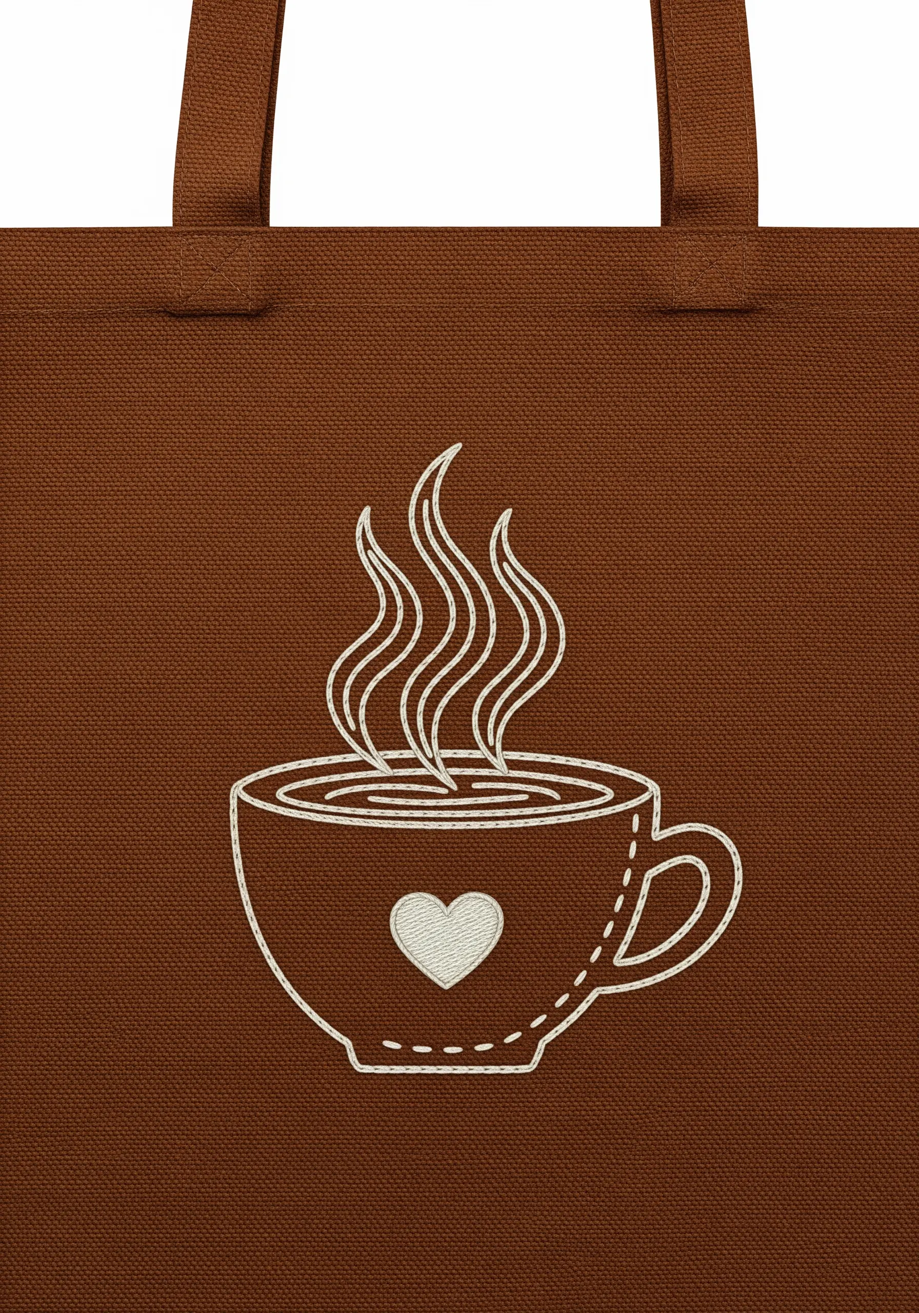 A line art coffee cup with a satin stitch heart, embroidered in white on brown canvas.