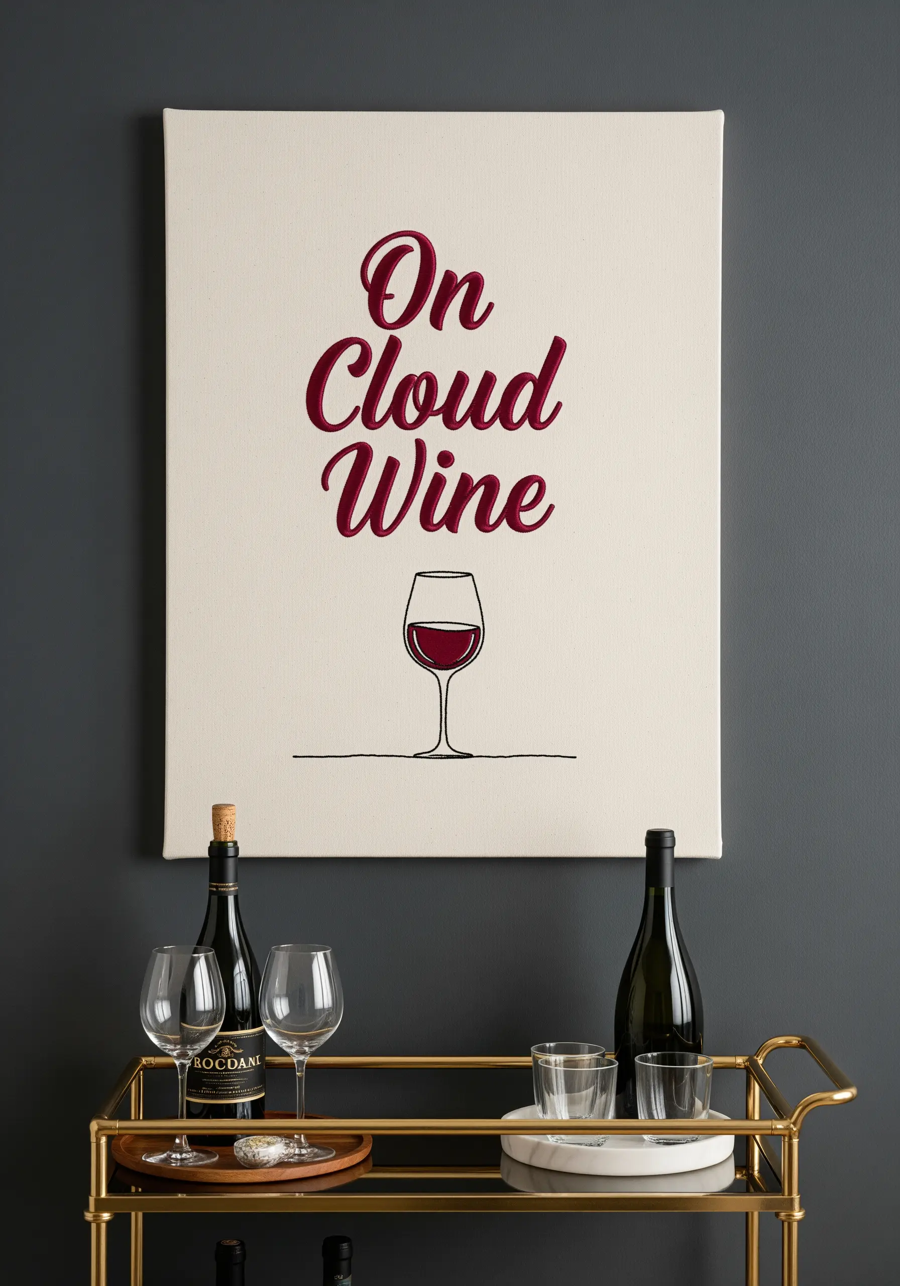 Embroidered canvas with the text 'On Cloud Wine' and a simple line art wine glass.