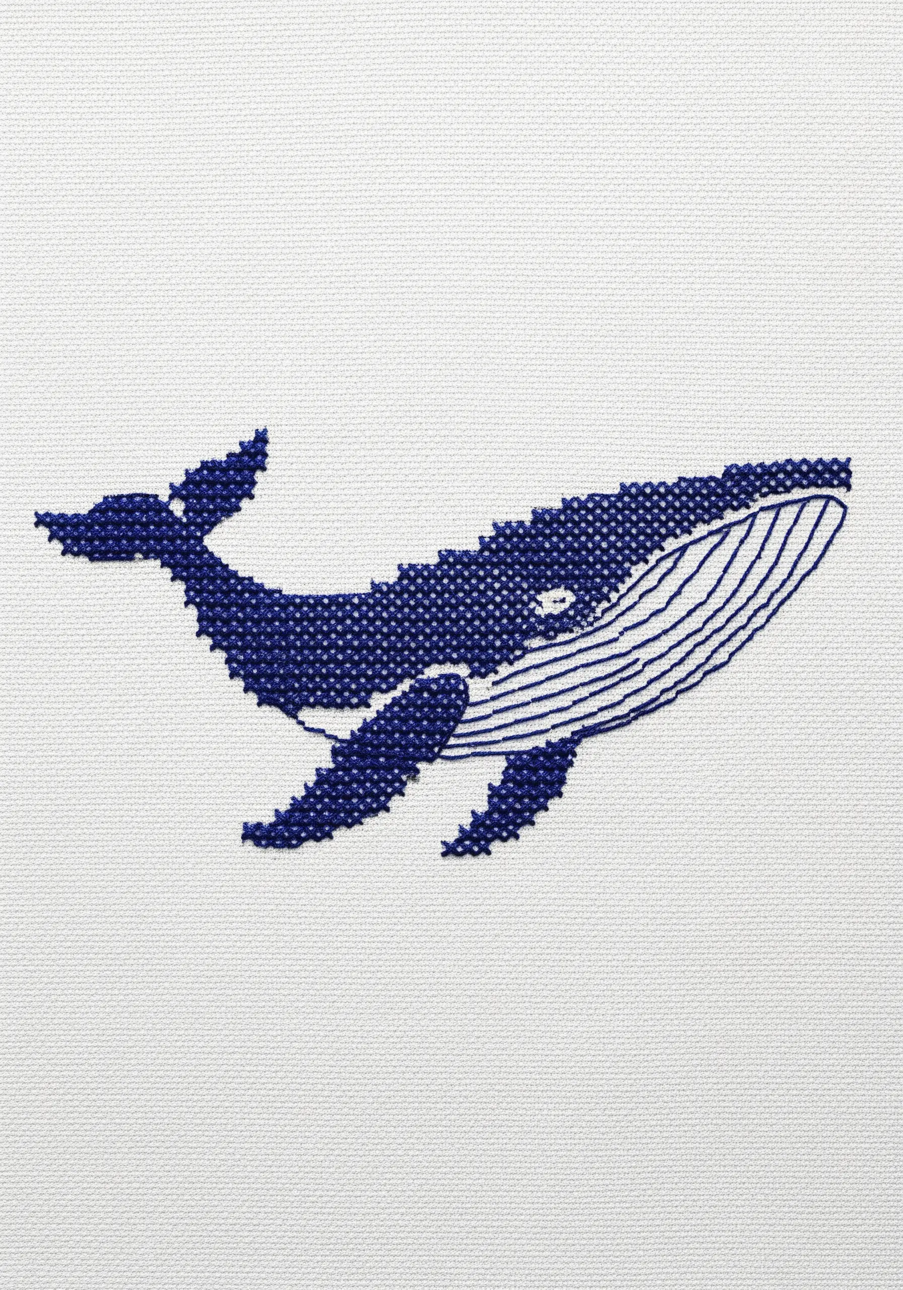 A cross-stitched whale combining solid fill stitches with fine backstitch line details.