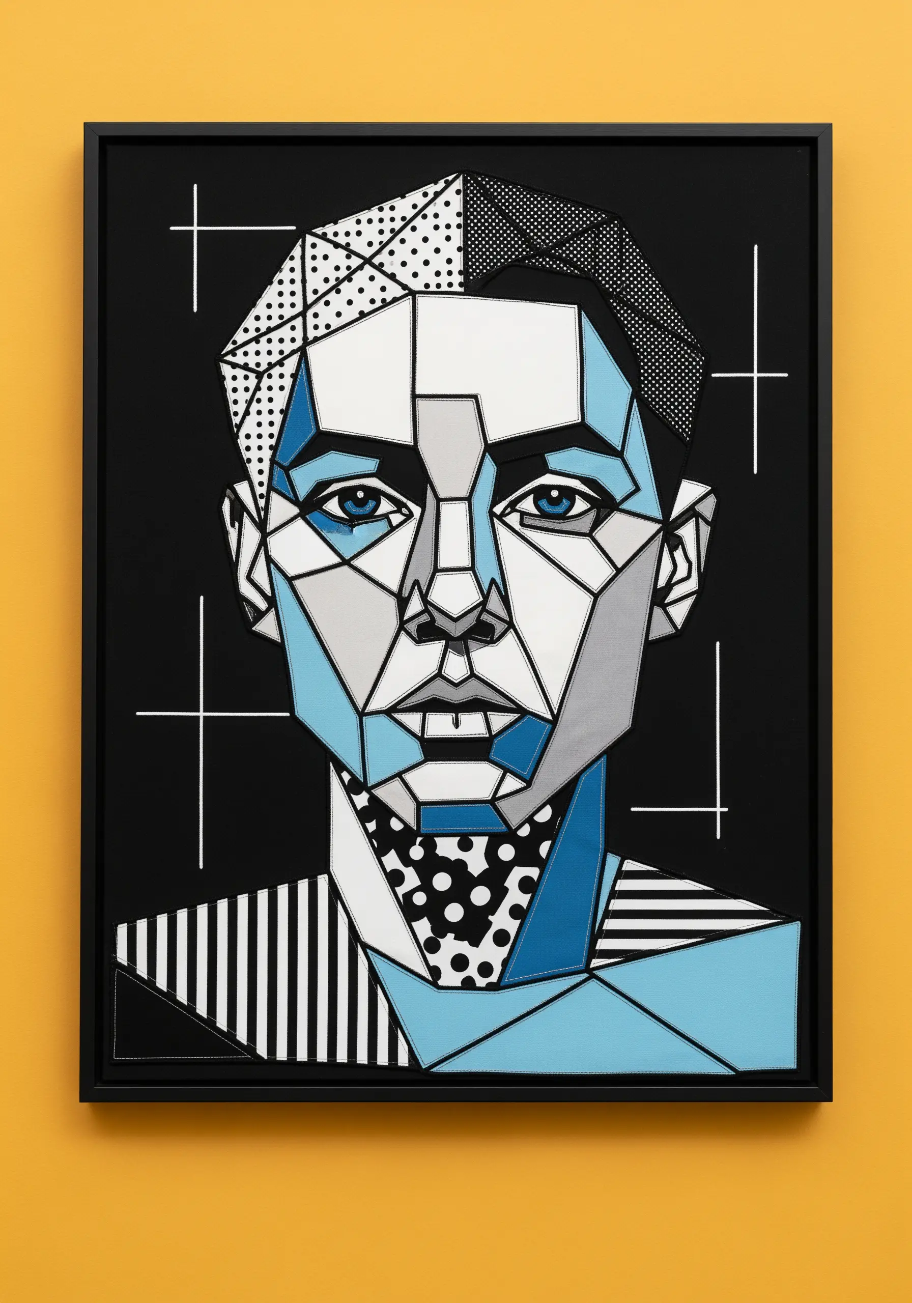 Abstract geometric portrait using patchwork fabric with dots and stripes in a black frame.