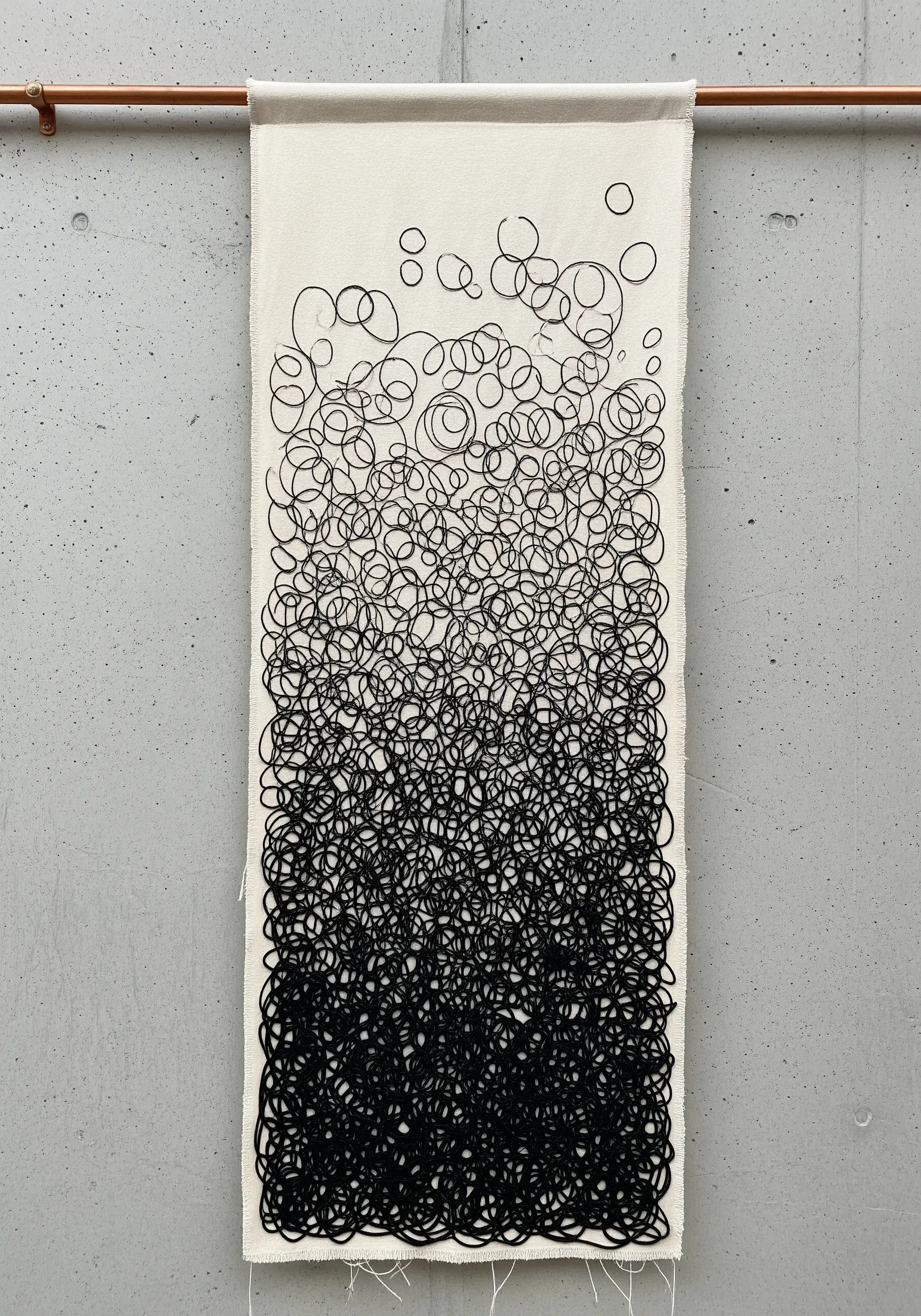 Vertical panel with black scribble stitching fading to white