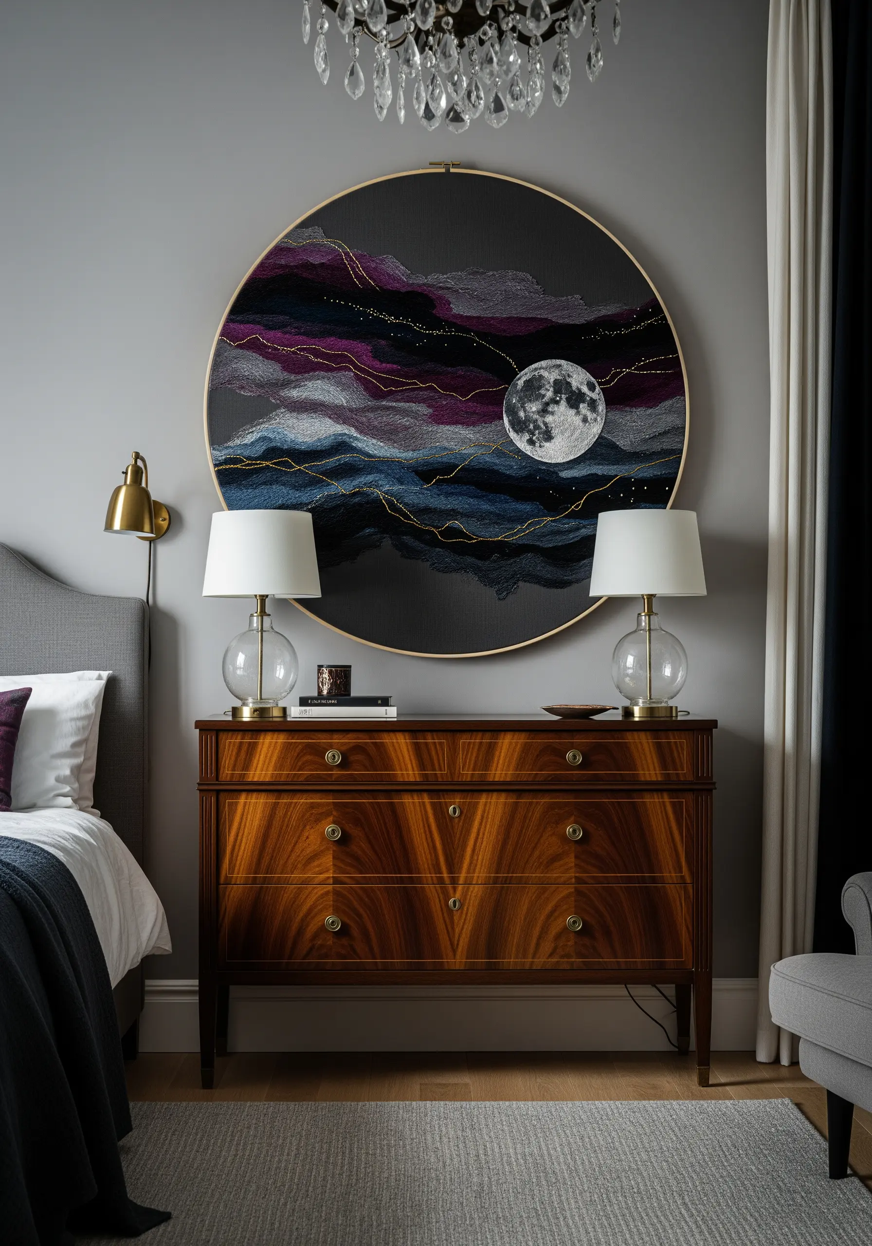 A large embroidery of a realistic moon over abstract, colorful clouds.