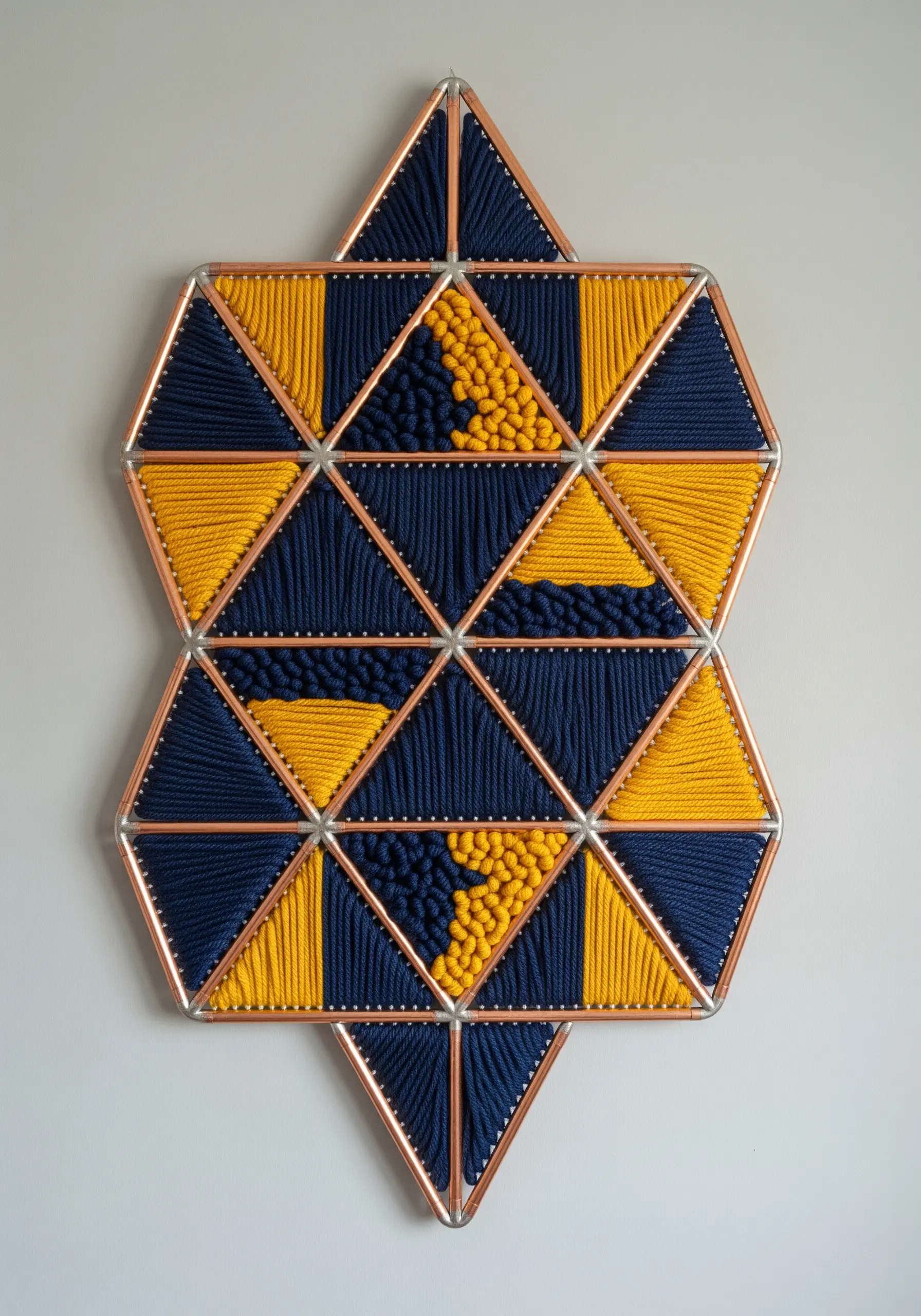 Copper pipe frame with geometric navy and yellow string art