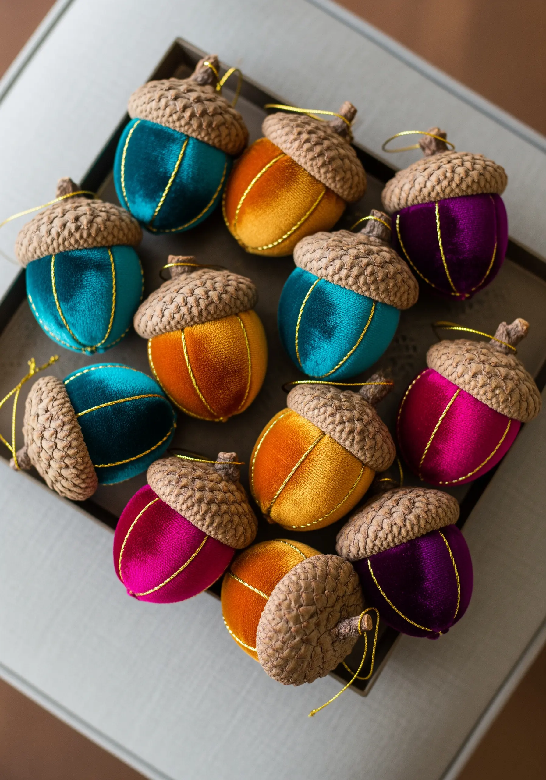 Velvet acorns in rich jewel tones with gold thread detailing