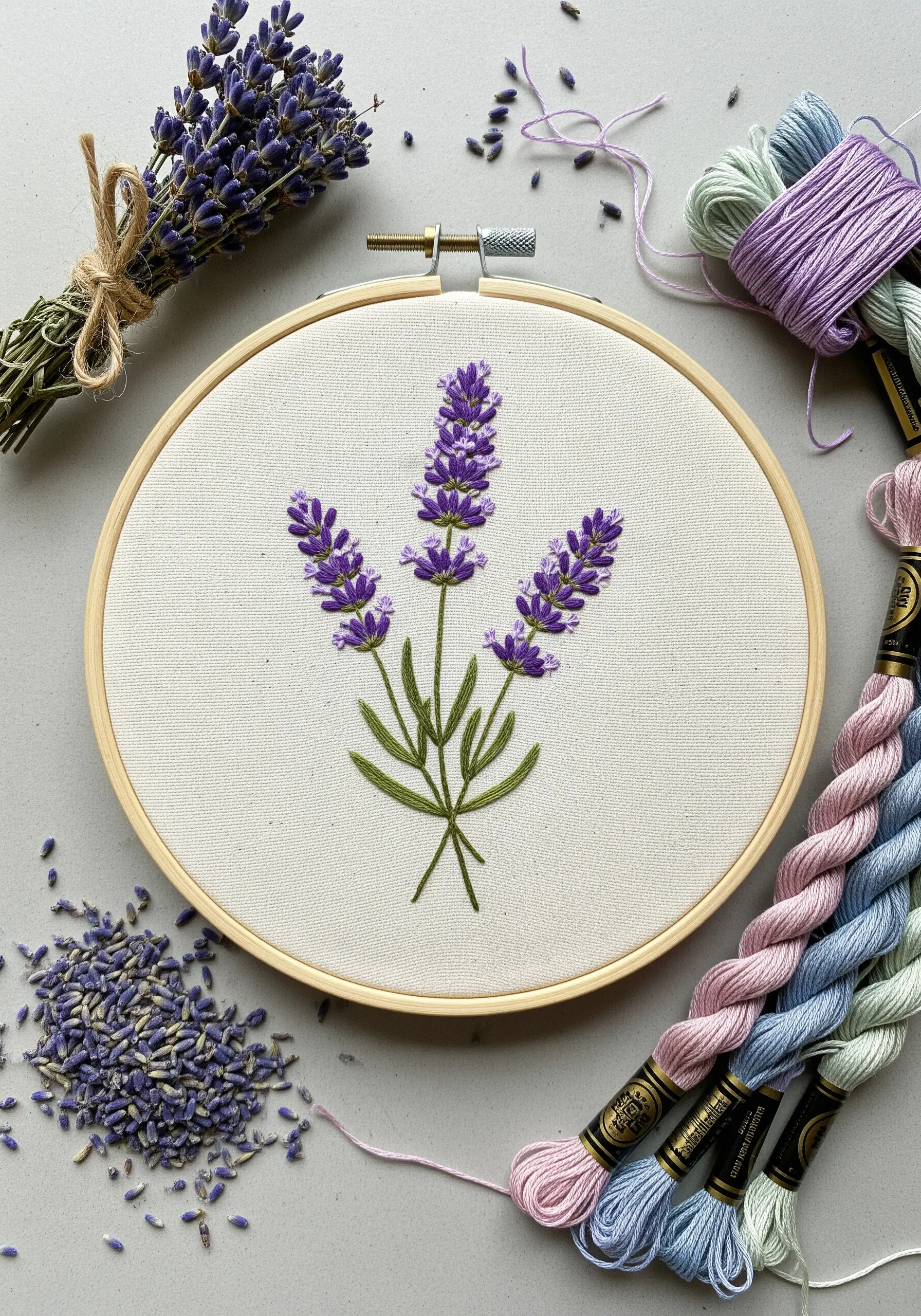 Three-dimensional lavender sprigs embroidered with purple bullion knots and green stems.