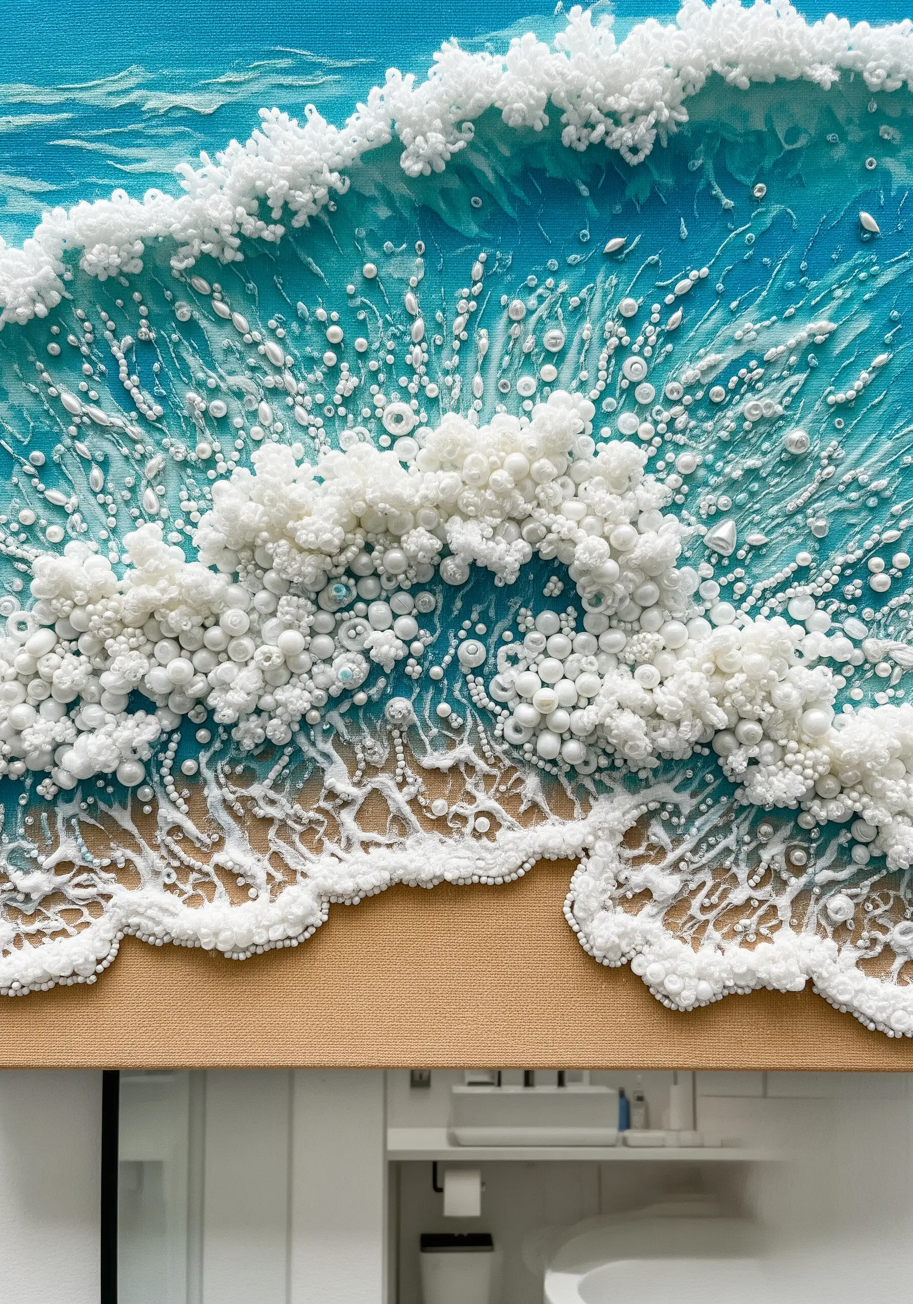 A close-up of a mixed-media wave with dense clusters of white beads and French knots for foam.