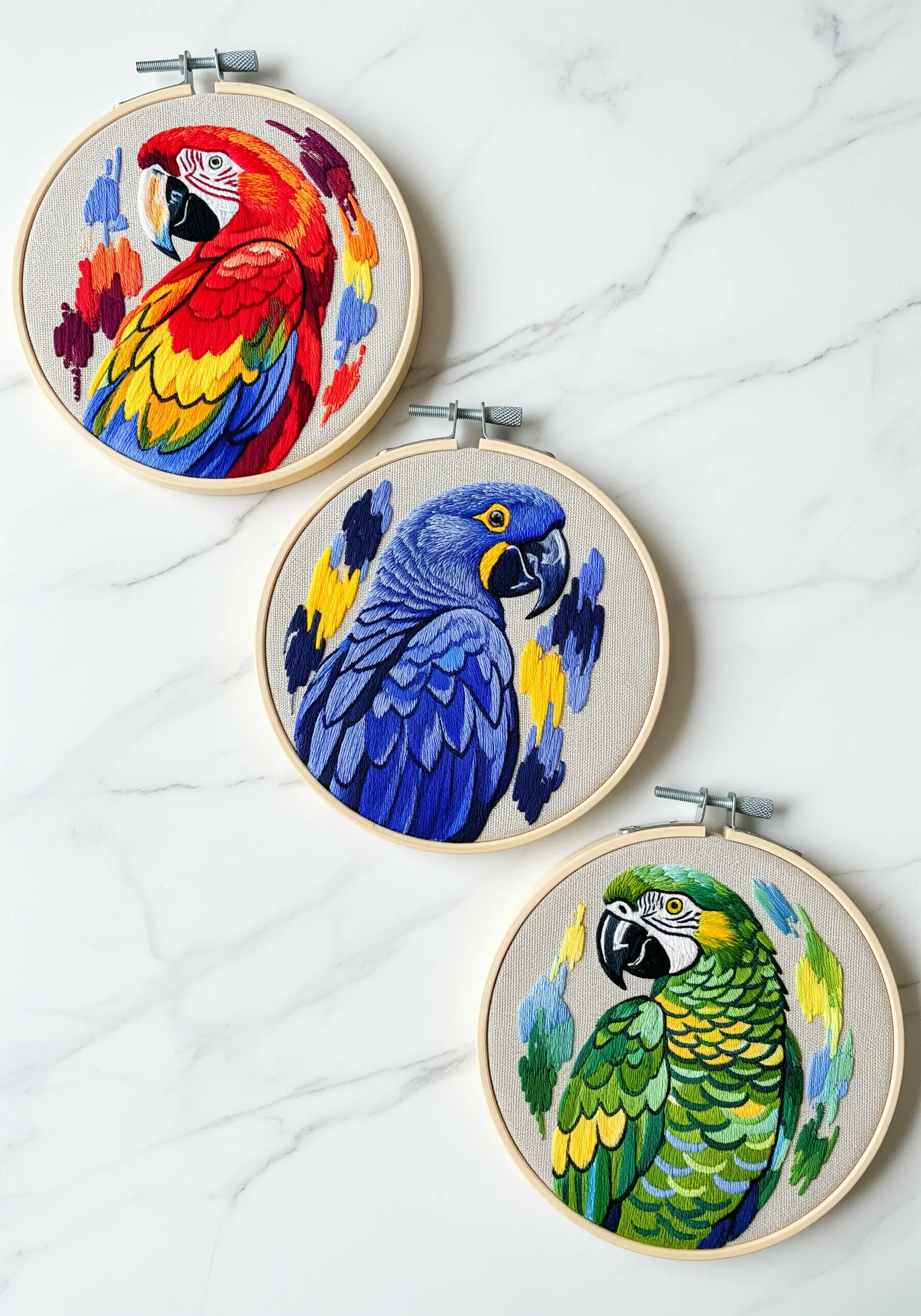 A triptych of three macaw portraits, each with a different color scheme and abstract background.