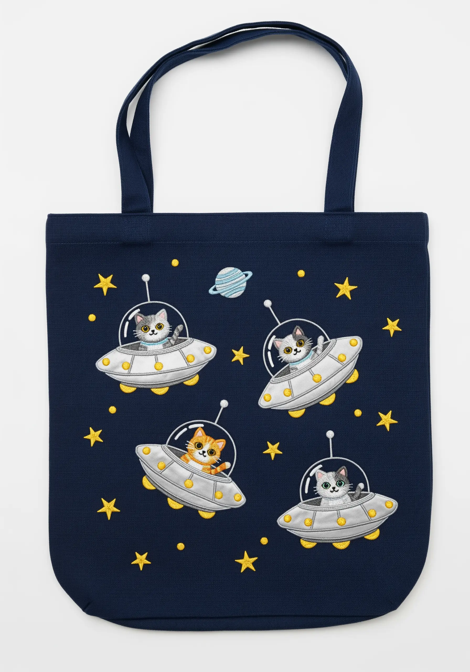 Cute cartoon cats in silver metallic UFOs against a dark blue, starry background.