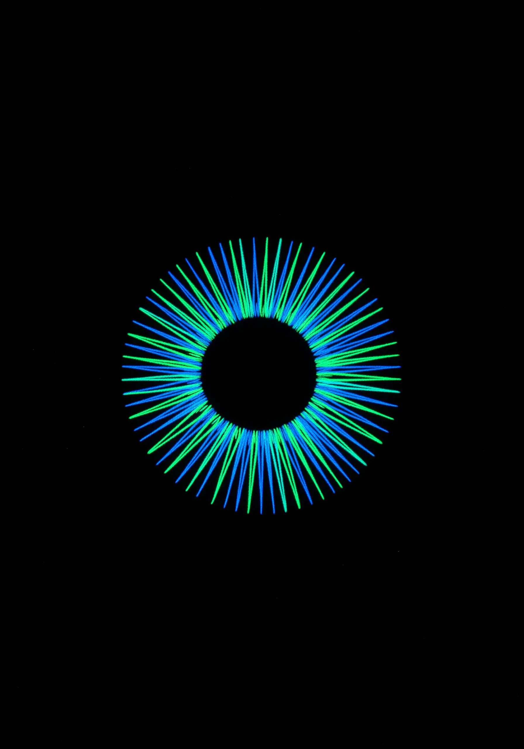 A radial burst of neon blue and green straight stitches on a black background.
