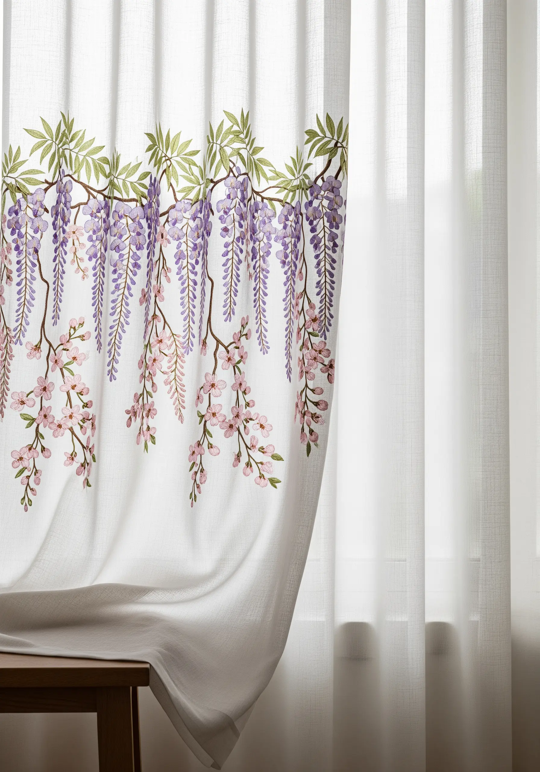 A sheer white curtain embellished with cascading embroidered wisteria and blossoms.