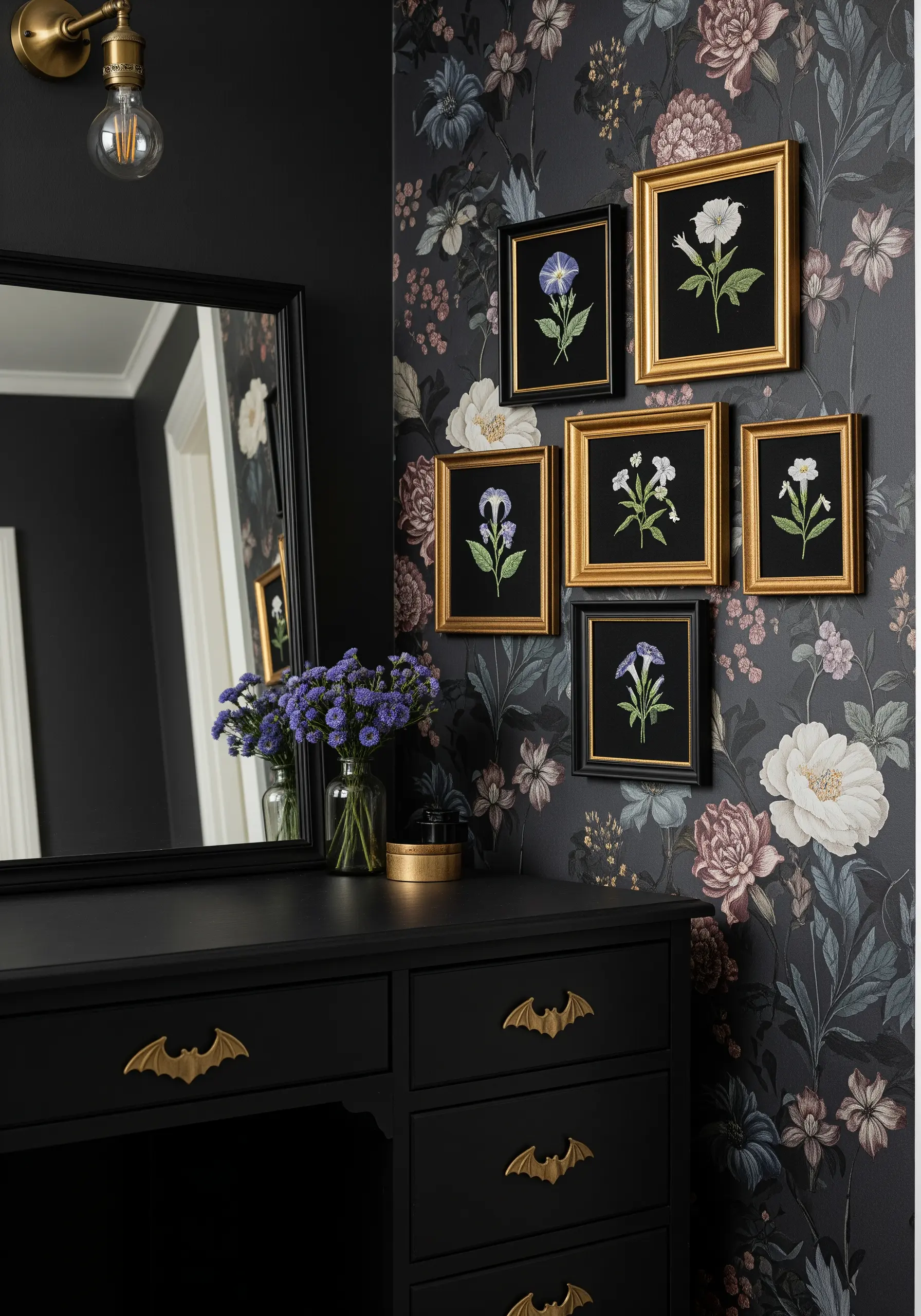 A collection of framed floral embroideries hanging on a wall with dark floral wallpaper.