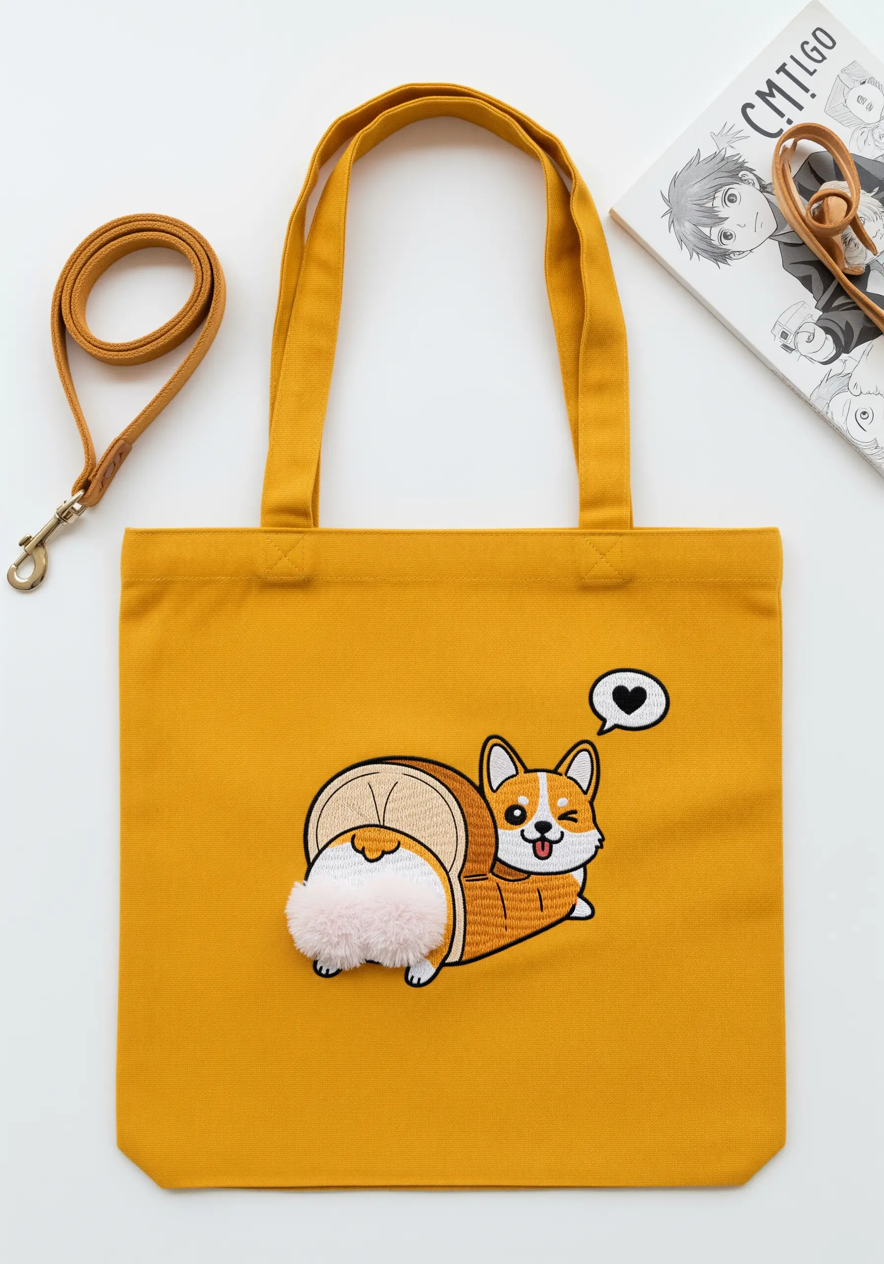 A cute embroidered corgi with a fluffy, 3D tail made using turkey work stitch.