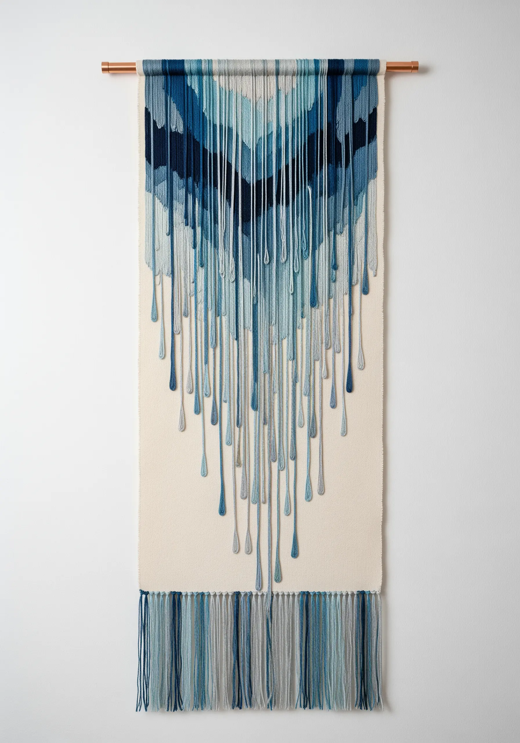A modern wall hanging with blue threads dripping down from a woven top section, creating a liquid effect.