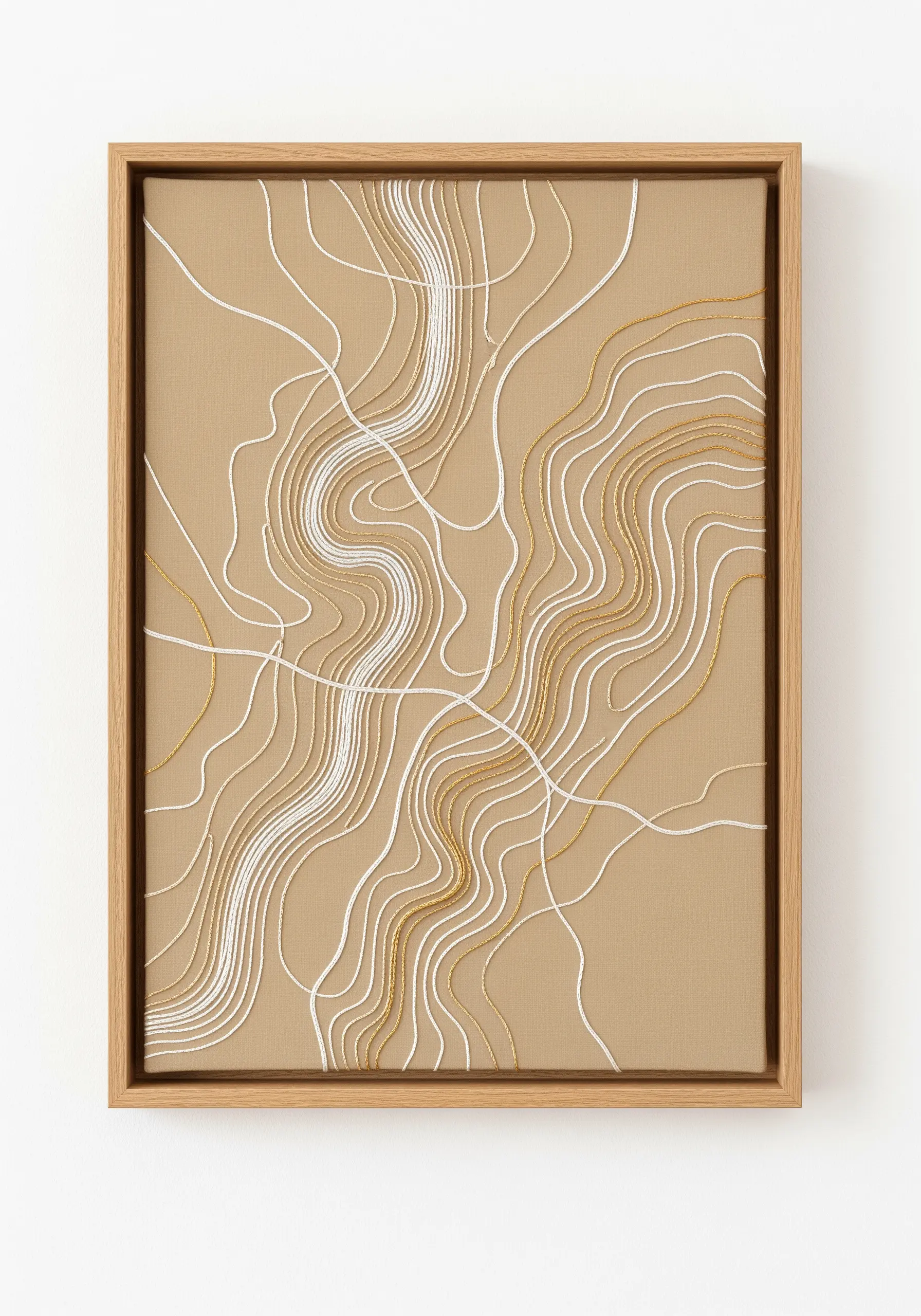 An abstract topographic map embroidered with white and gold contour lines.