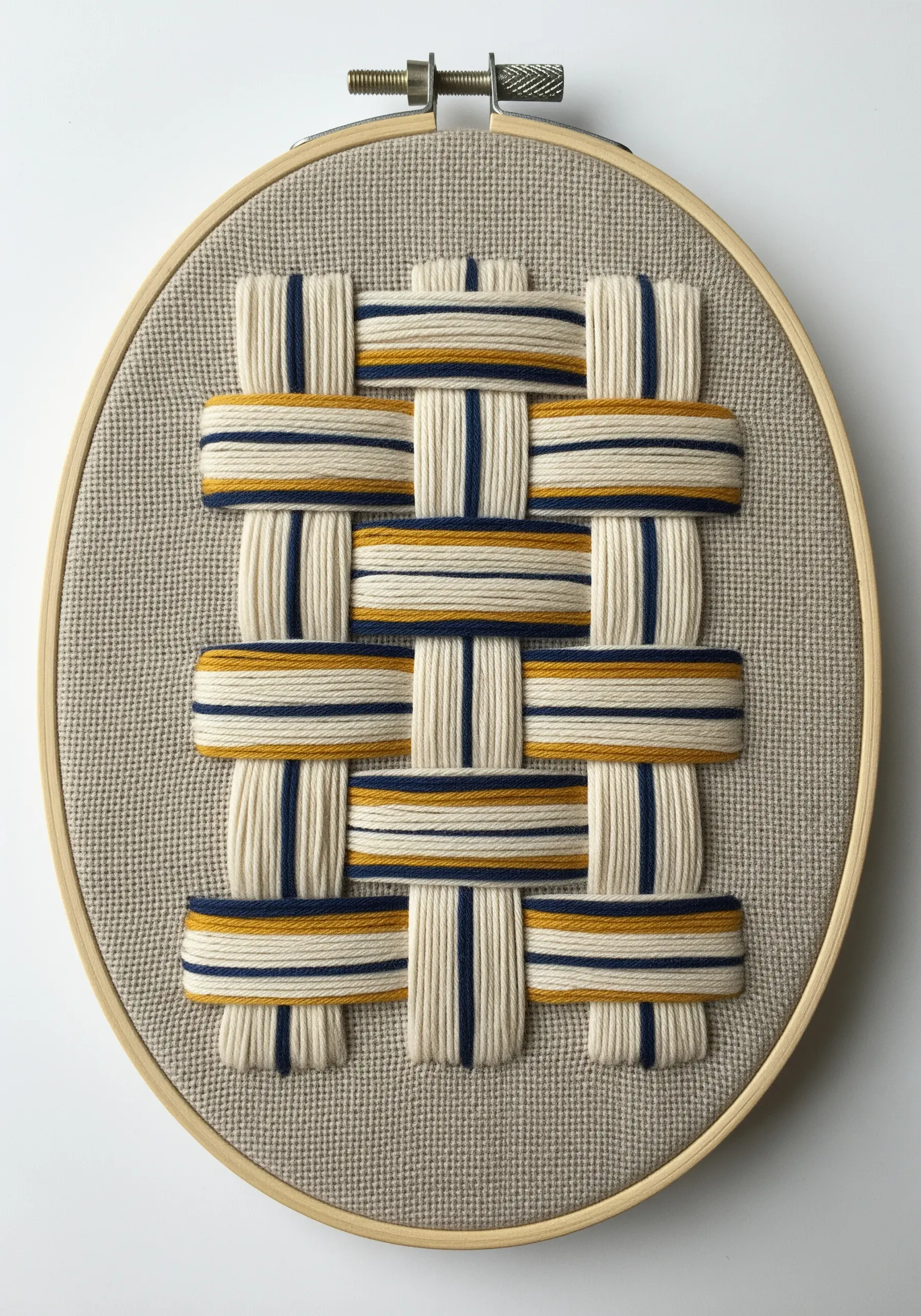 A woven-style embroidery with thick cream, yellow, and blue threads on linen.