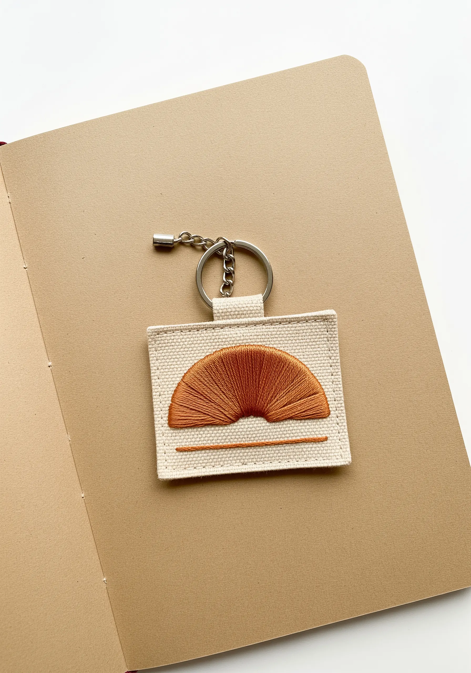 Abstract rising sun motif with an orange gradient using long-and-short stitch