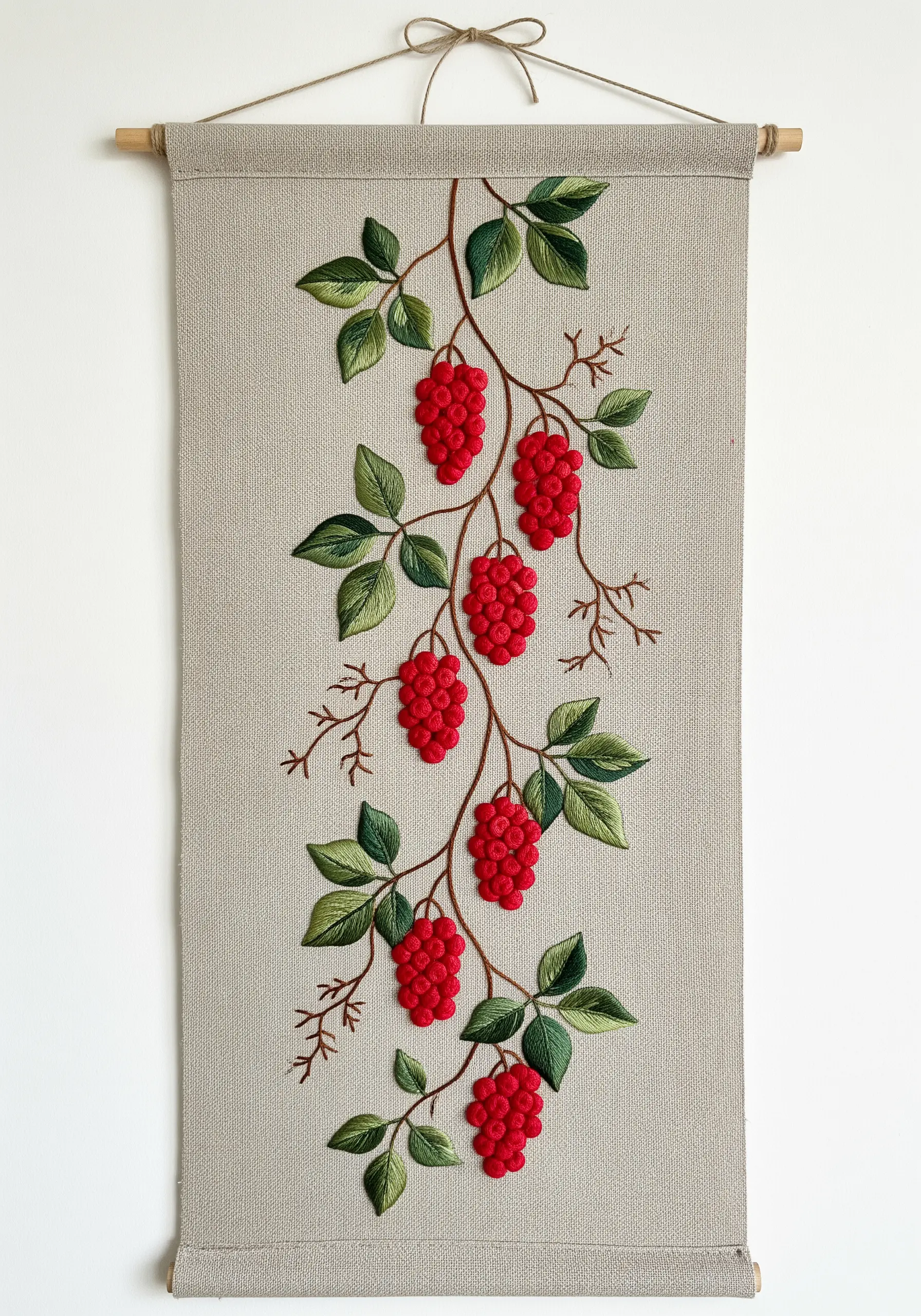 A vertical embroidery of a Schisandra vine with dimensional red berries.