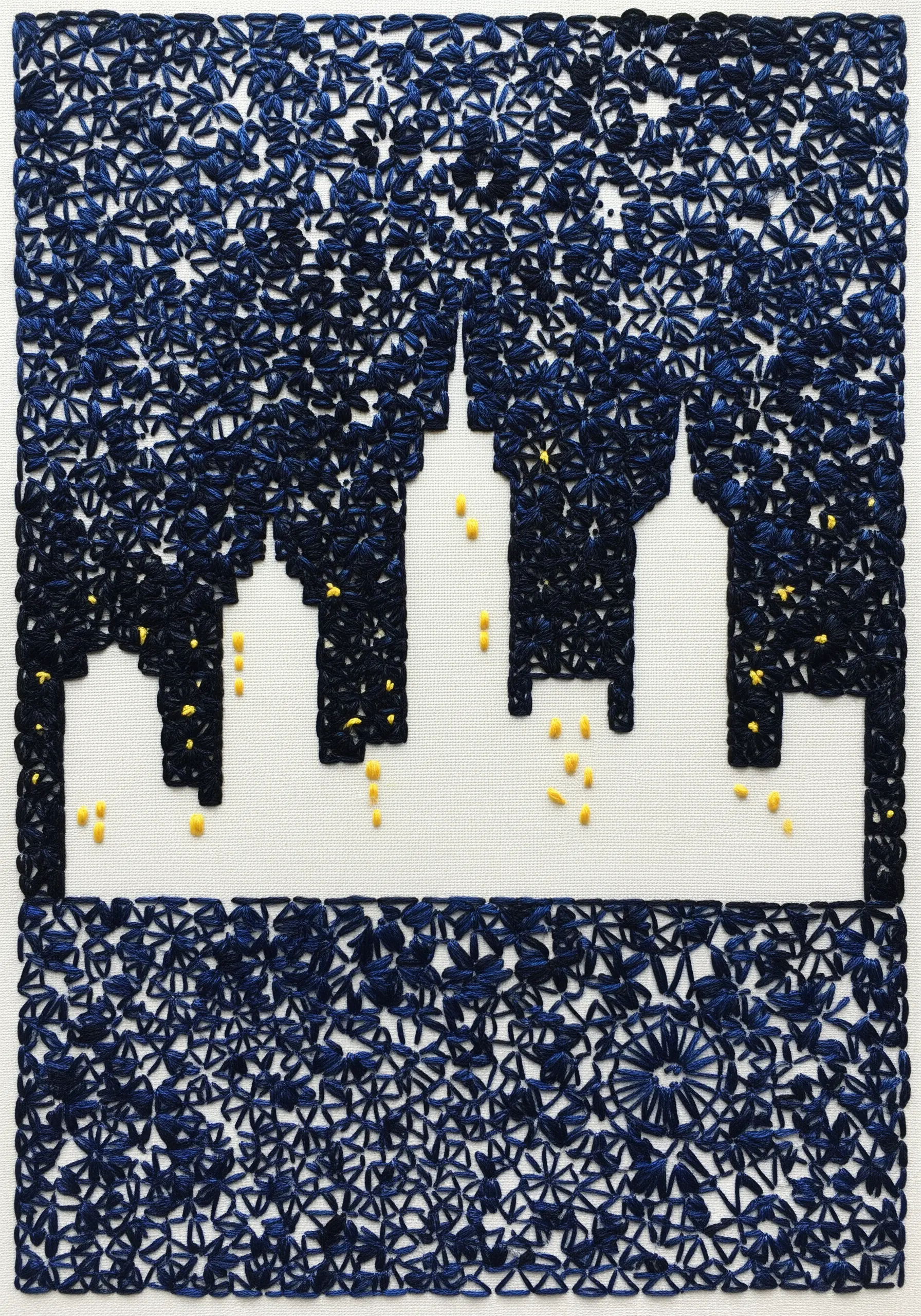 A city skyline created using negative space, with the sky filled in with dense blue star stitches.