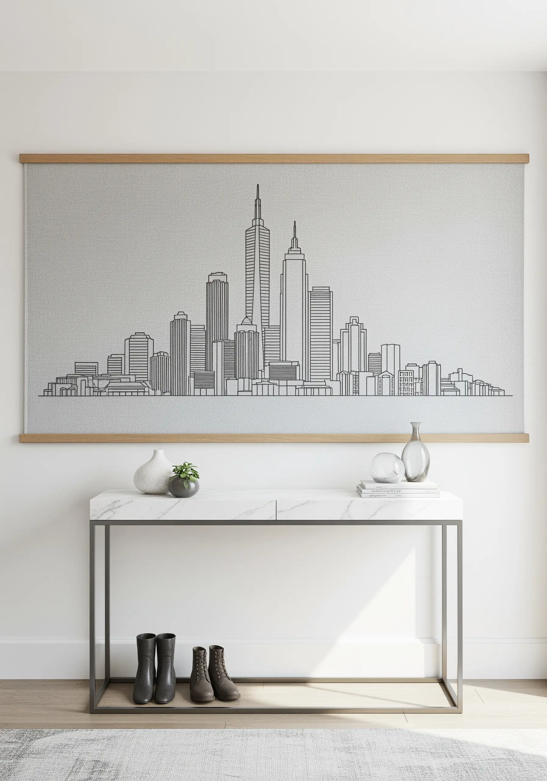 A large embroidered wall hanging of a city skyline using simple black line work.