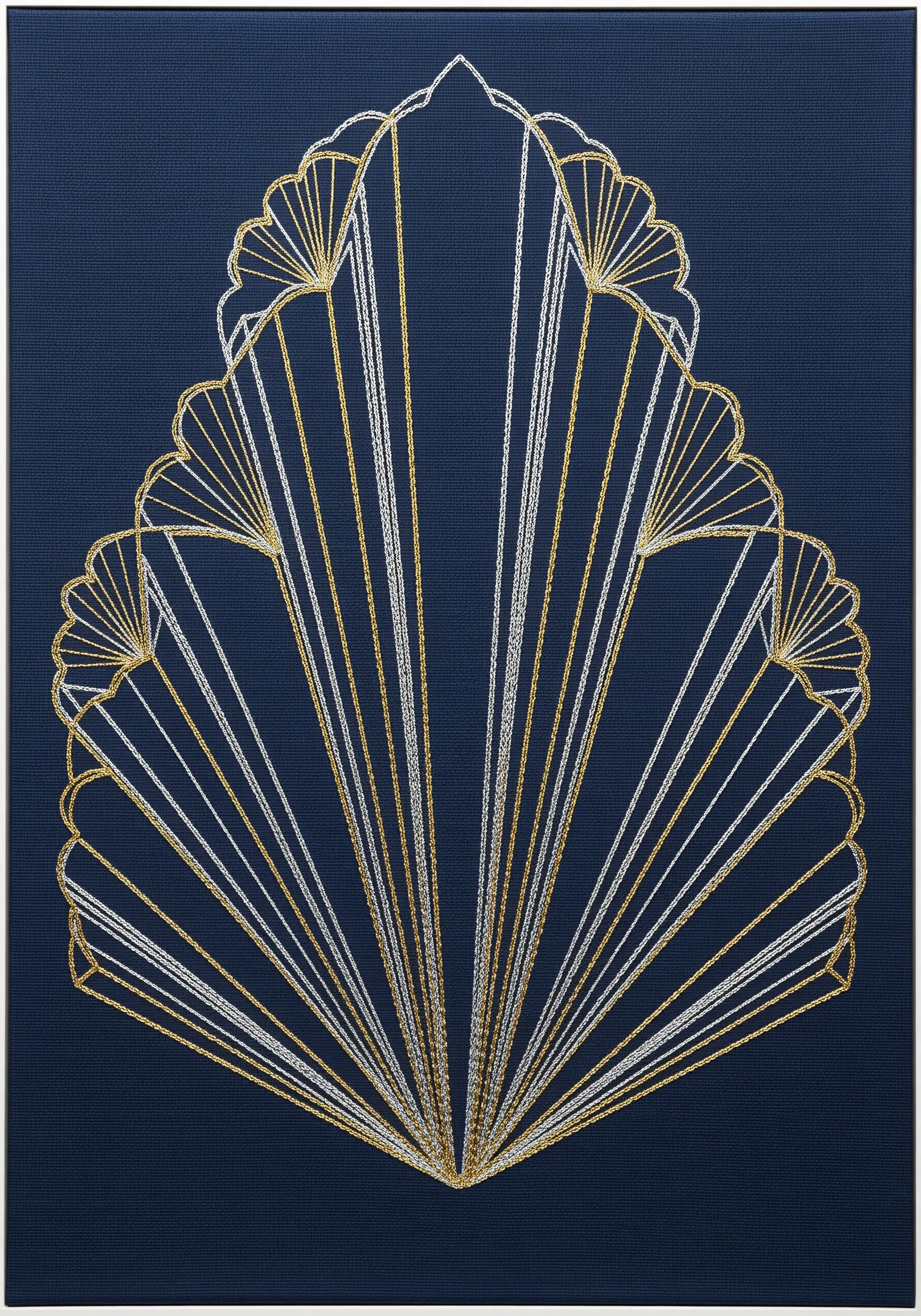 An Art Deco fan design made with radiating gold and silver threads on dark blue fabric.